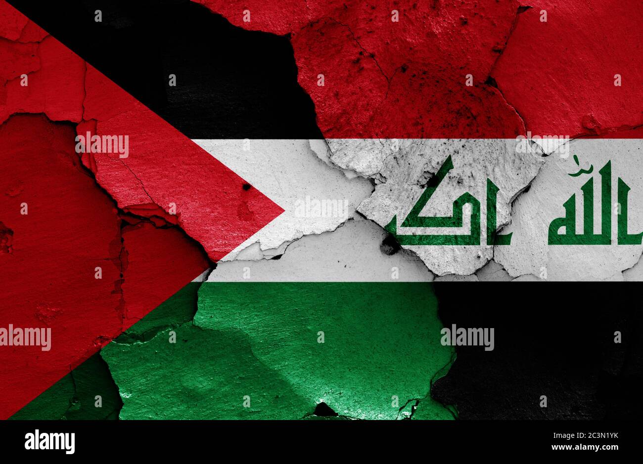flags of Palestine and Iraq painted on cracked wall Stock Photo