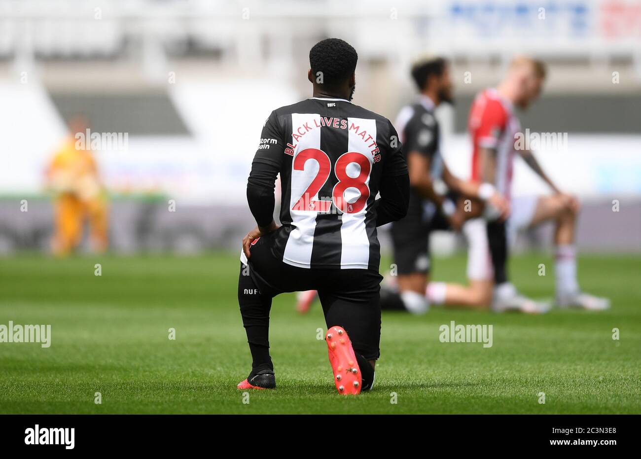 Newcastle United's Danny Rose takes a knee in support of the Black Lives Matter movement during the Premier League match at St James' Park, Newcastle. Stock Photo