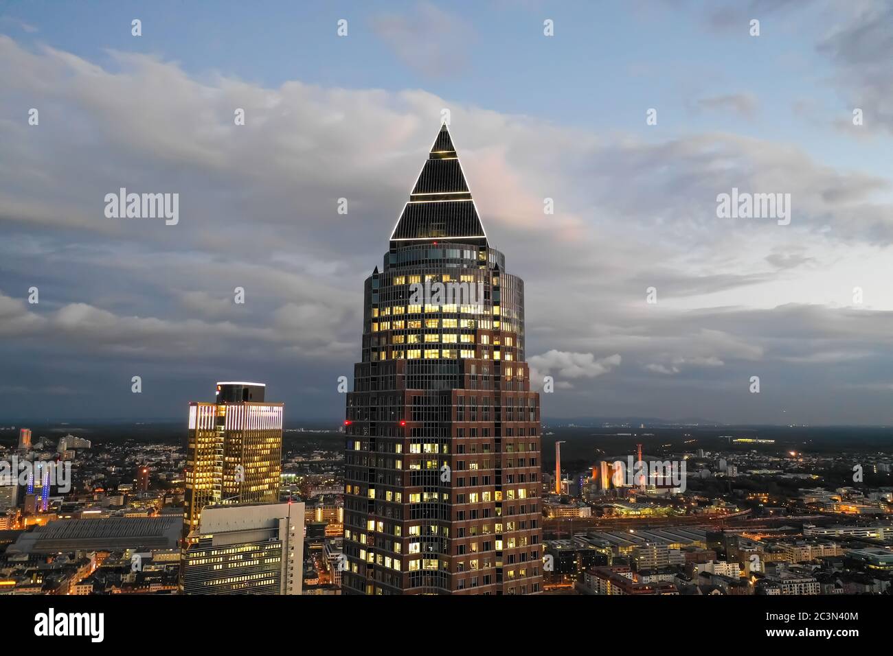 Circa November 2019: Incredible Aerial Close Up View of Messeturm in Frankfurt am Main, Germany Skyline at Night with City Lights Stock Photo