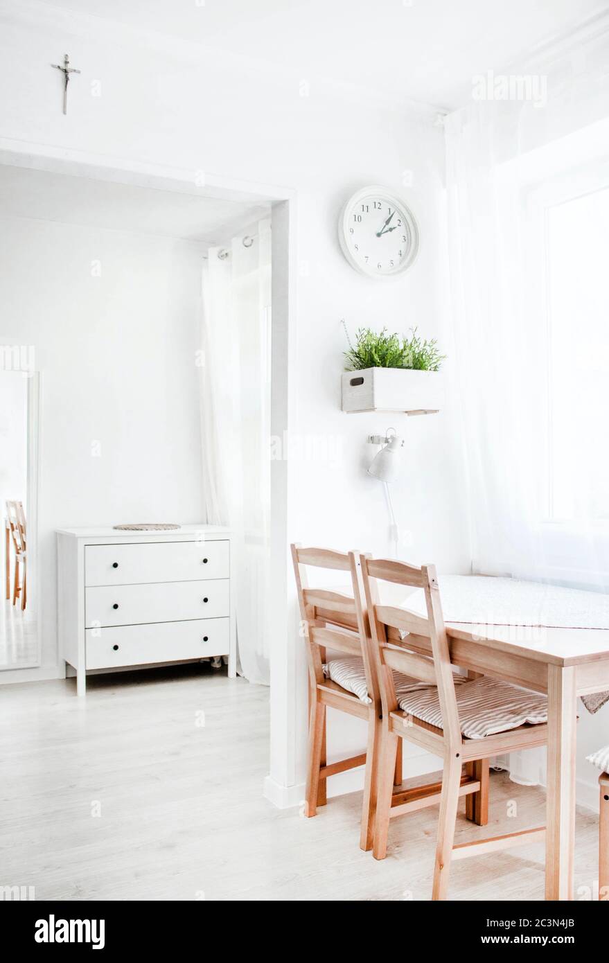 Vertical shot of a white interior with wooden elements Stock Photo