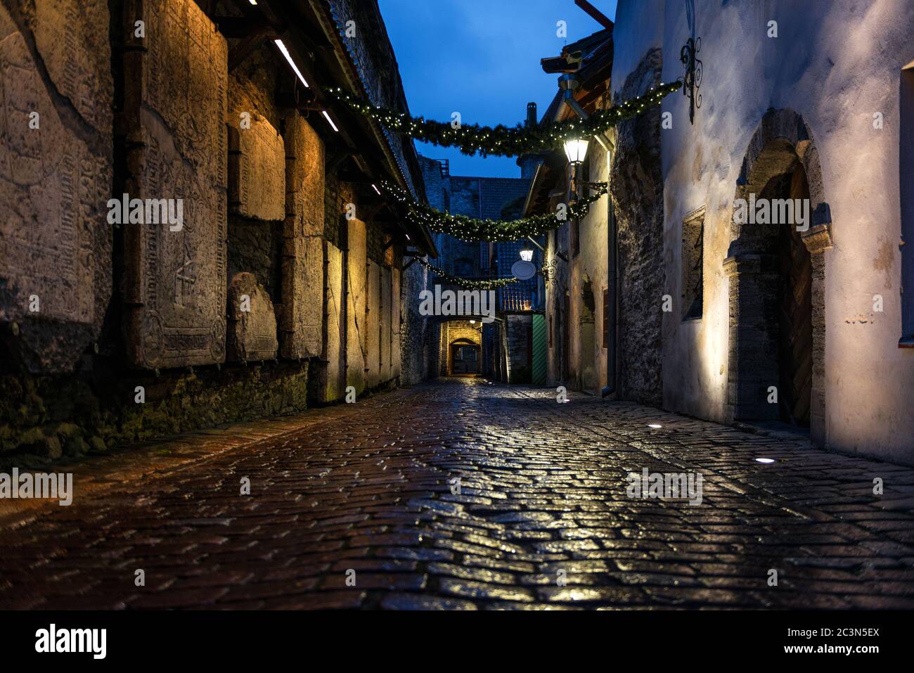 Night view of St. Catherine’s Passage in Tallinn, Estonia, a medieval passage containing some of the old remainings of a Dominican Monastery. Stock Photo