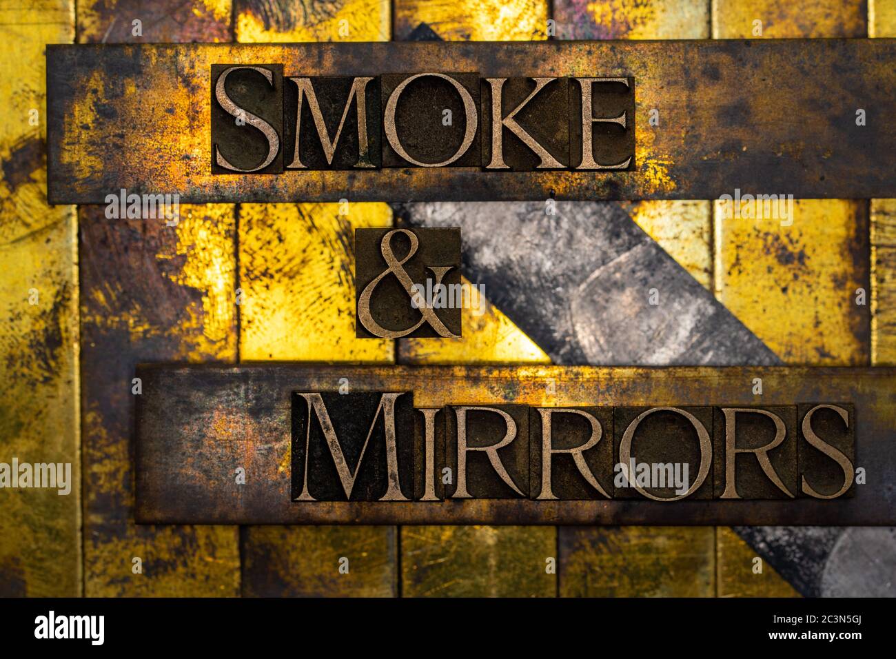 Smoke and Mirrors text formed with real authentic typeset letters on vintage textured silver