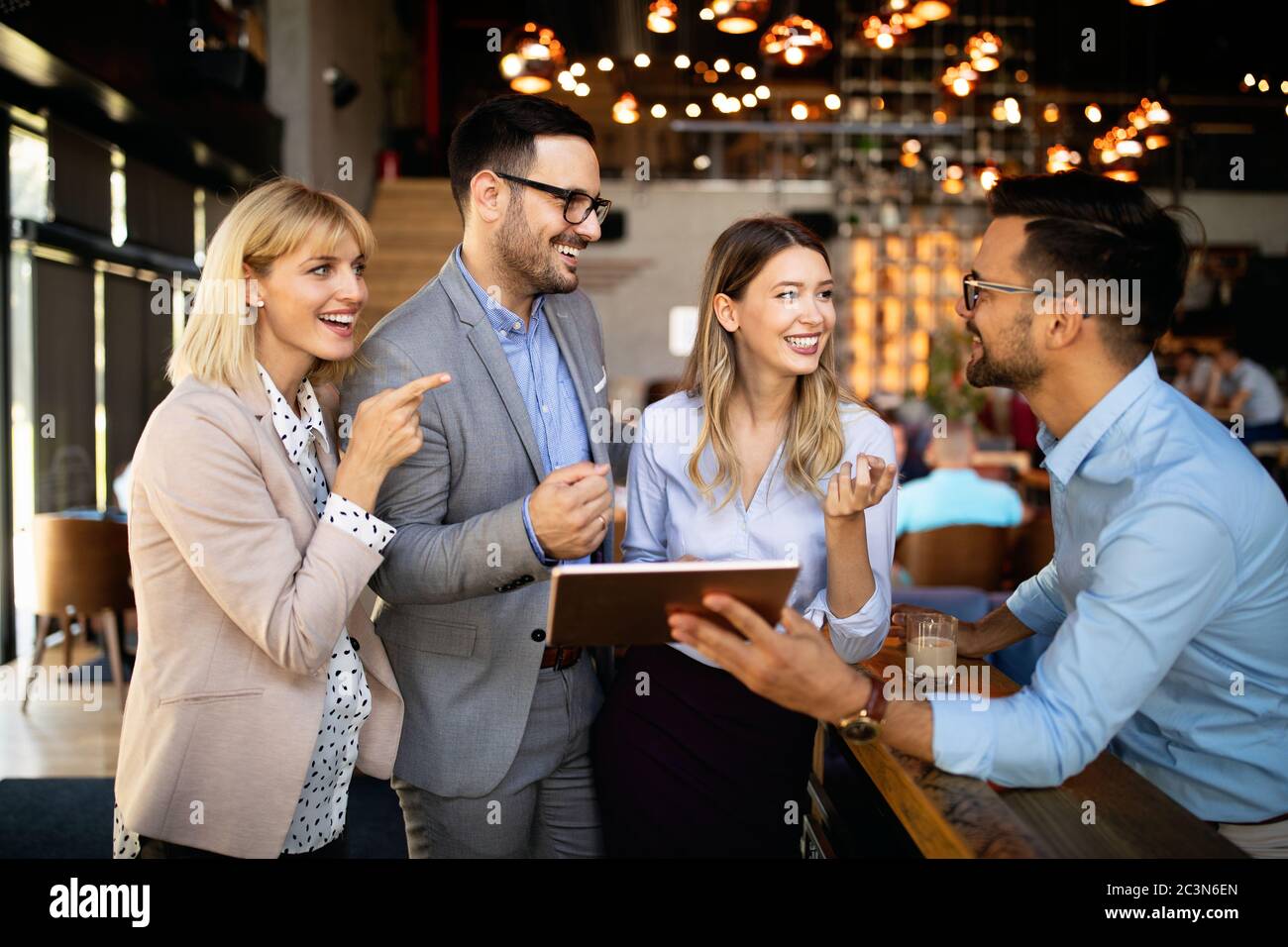 Business colleagues having conversation during coffee break Stock Photo