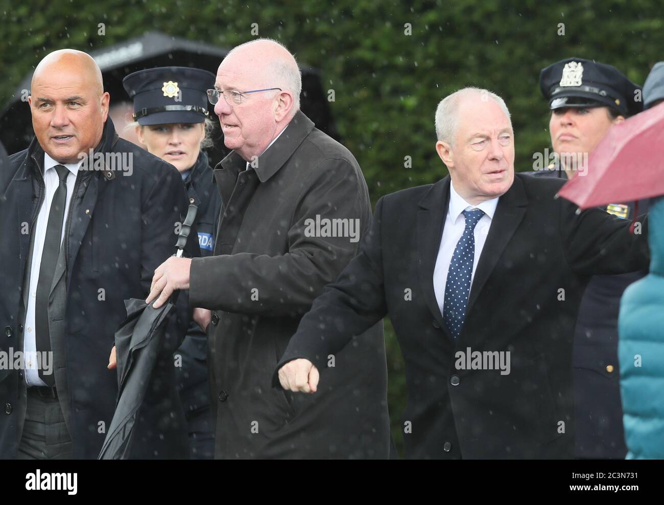 minister-for-justice-charles-flanagan-centre-and-minister-for-rural-community-development-michael-ring-right-at-the-funeral-of-detective-garda-colm-horkan-at-st-james-church-in-charlestown-co-mayo-2C3N731.jpg