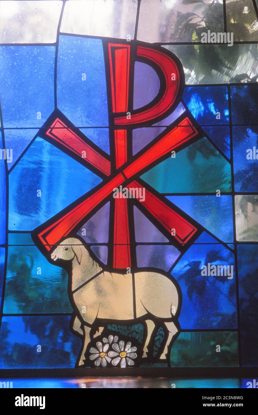 LOS ANGELS, UNITED STATES - Jan 12, 1986: Stained Glass image of Jesus as the sacrificial lamb and Prince of peace. Stock Photo