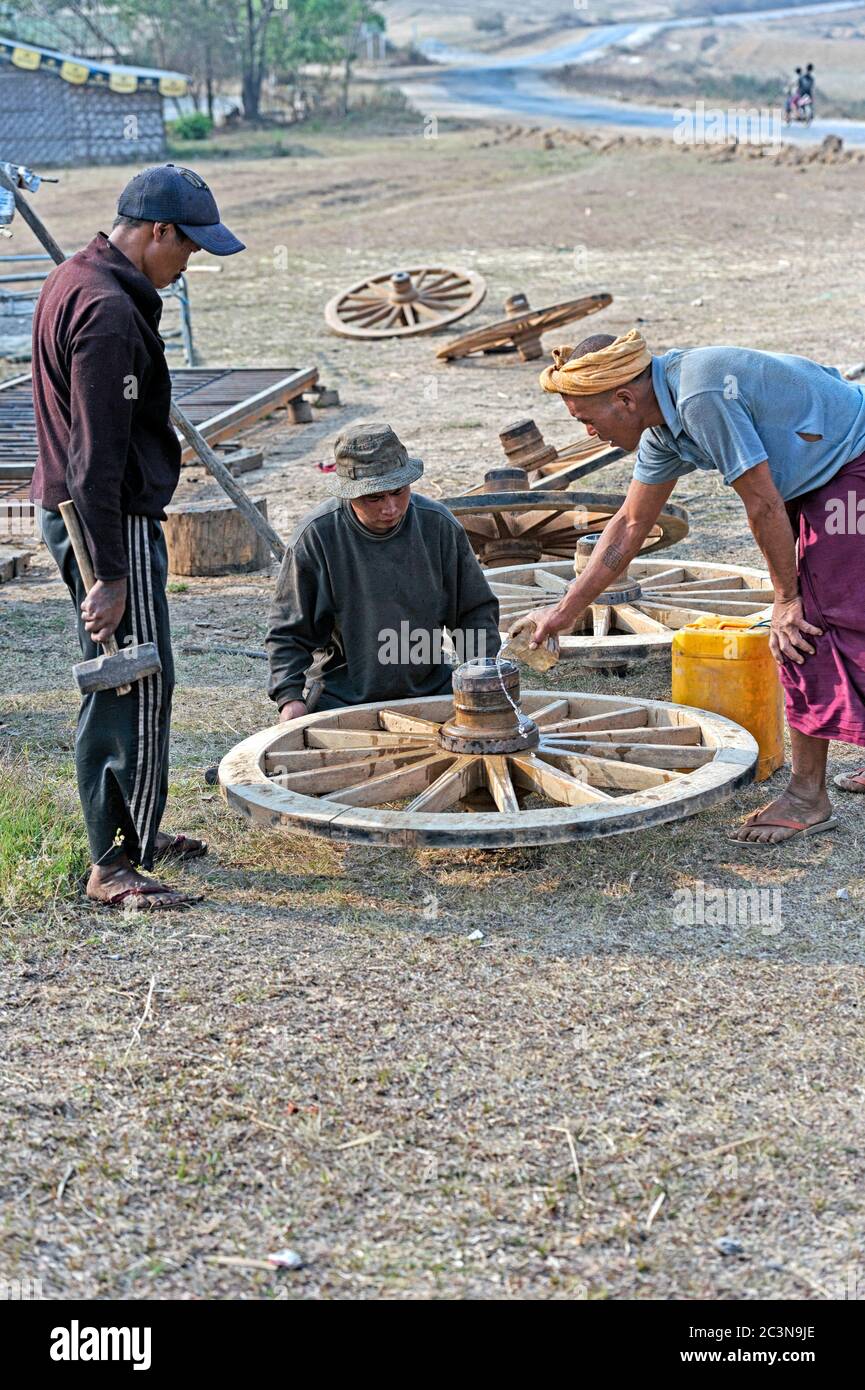 Repair and manufacture of wooden cartwheels in Taunggyi, Shan State Myanmar (Burma) Stock Photo
