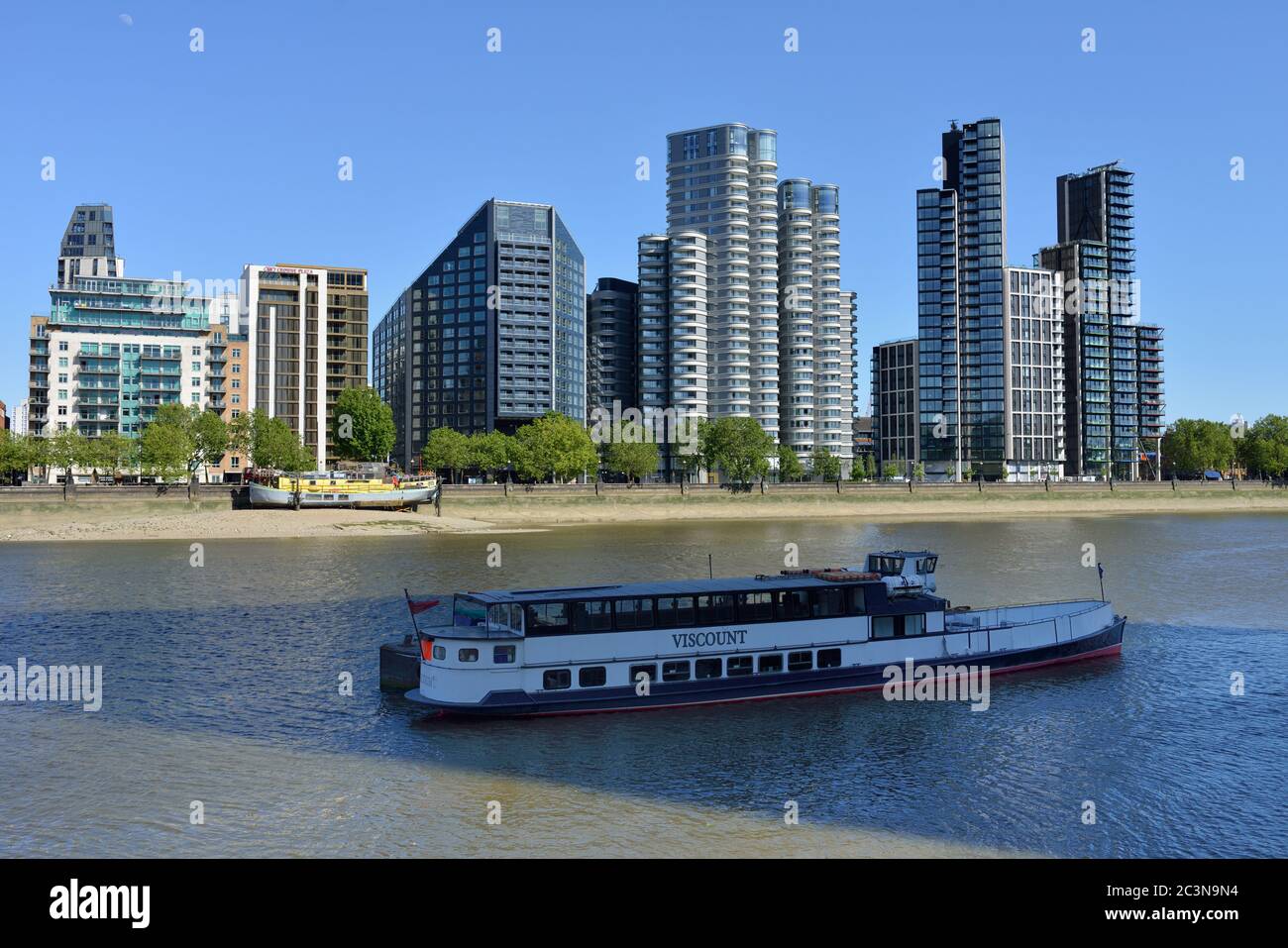 Thames river view of the Albert embankment including the Corniche and Dumont, near Nine Elms and Vauxhall, London, United Kingdom Stock Photo