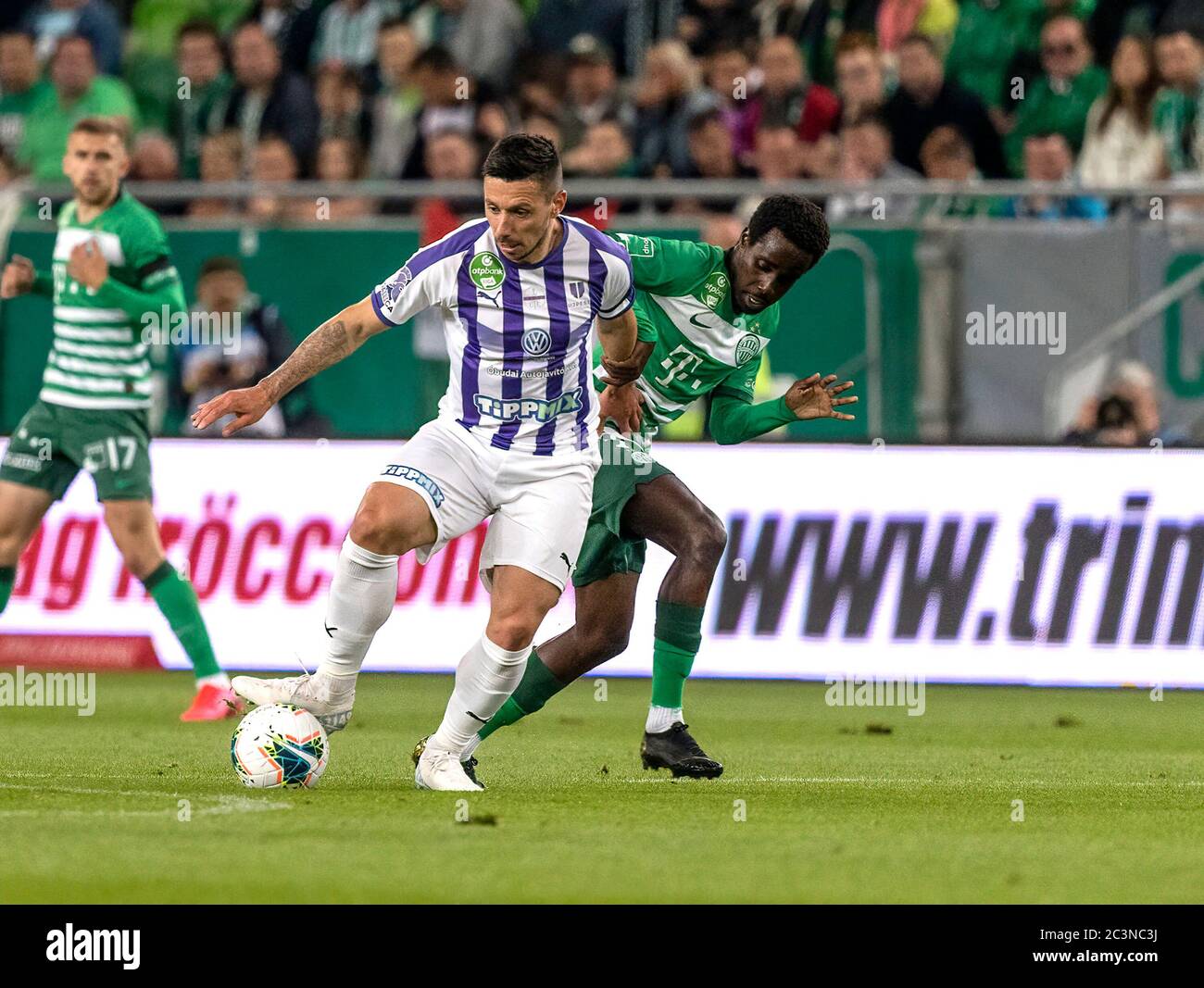 BUDAPEST, HUNGARY - JUNE 27: (l-r) Tokmac Chol Nguen of Ferencvarosi TC  fights for the ball with Dániel Farkas of Mezokovesd Zsory FC during the  Hungarian OTP Bank Liga match between Ferencvarosi TC and Mezokovesd Zsory  FC at Groupama