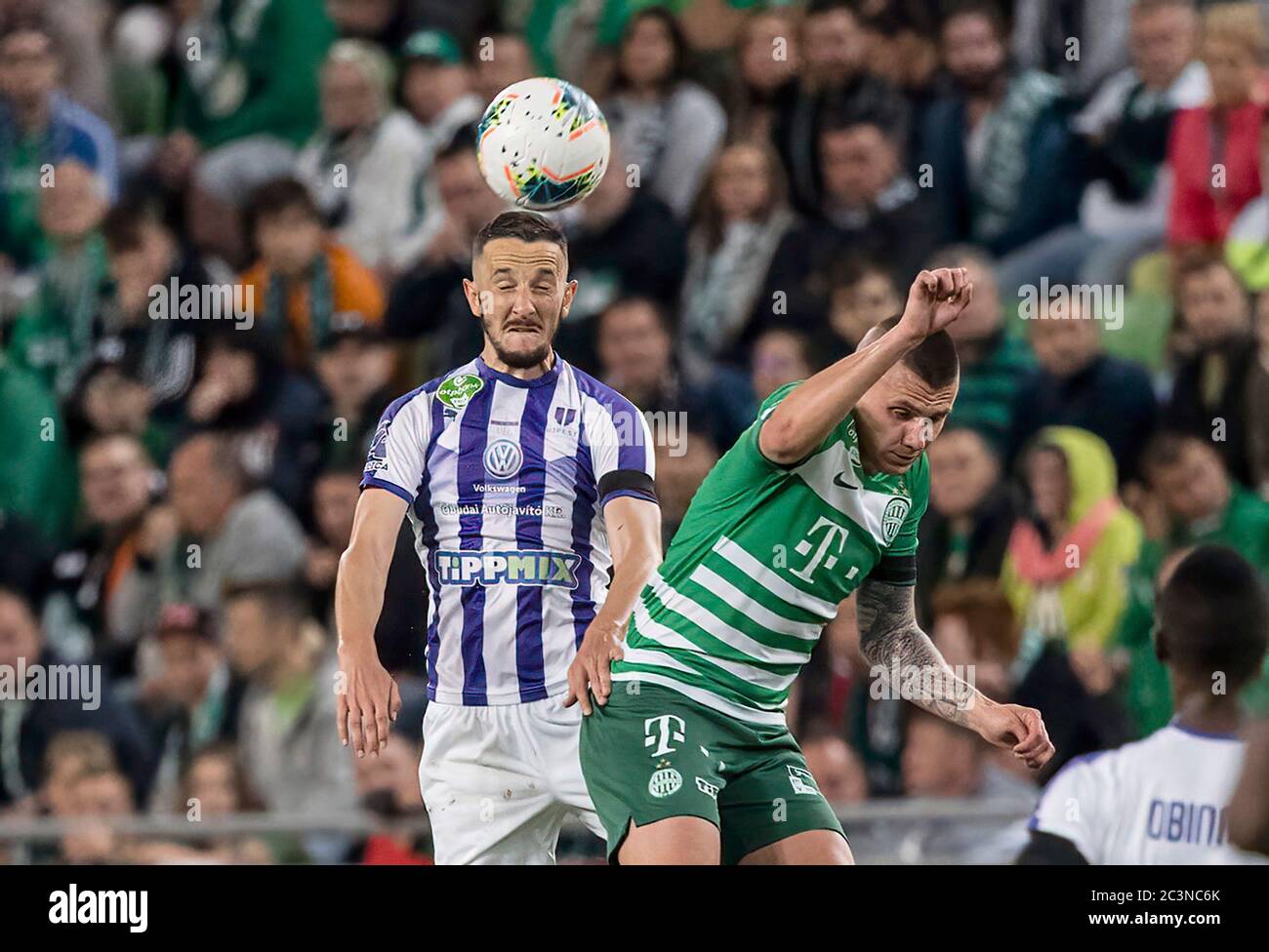 BUDAPEST, HUNGARY - JUNE 20: (r-l) Isael da Silva Barbosa of Ferencvarosi TC  challenges Dzenan Burekovic of Ujpest FC during the Hungarian OTP Bank Liga  match between Ferencvarosi TC and Ujpest FC