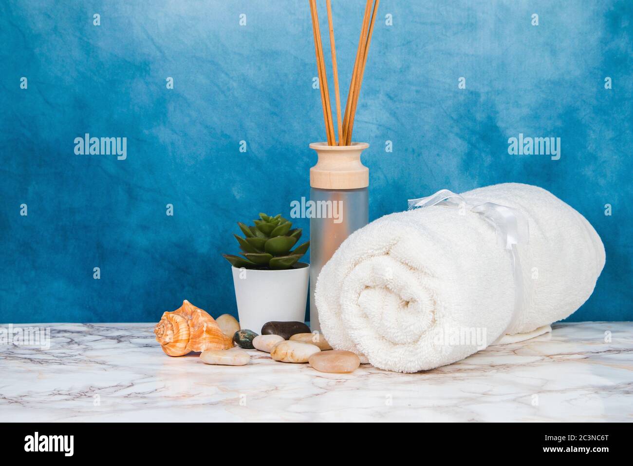 Spa objects and elements on a marble table and blue background Stock Photo