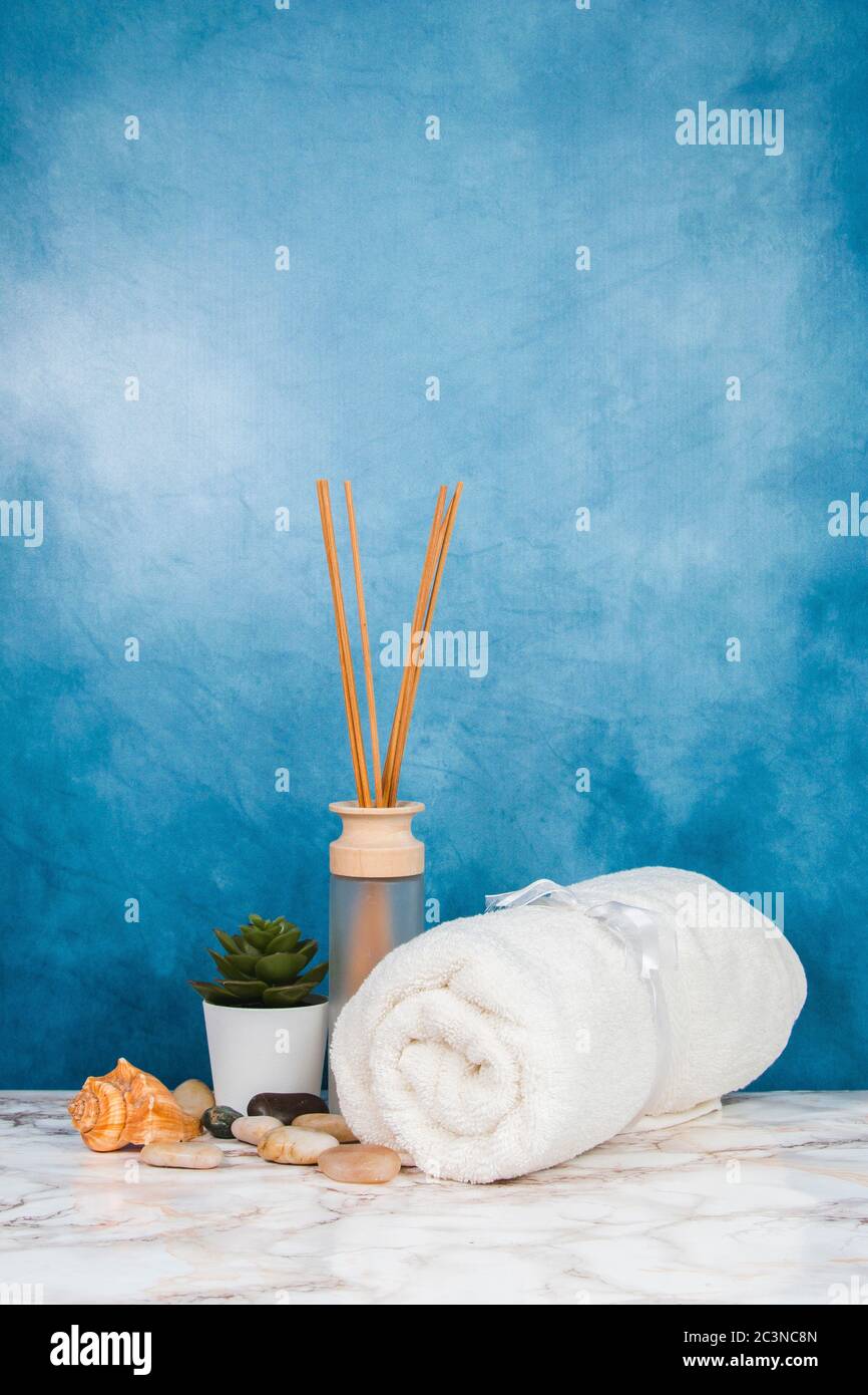 Spa objects and elements on a marble table and blue background Stock Photo