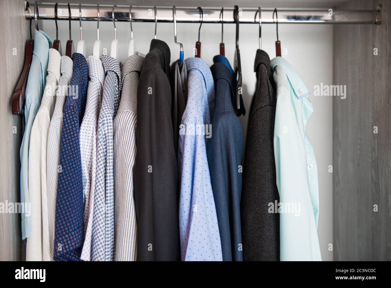 clothes on hangers in the closet Stock Photo