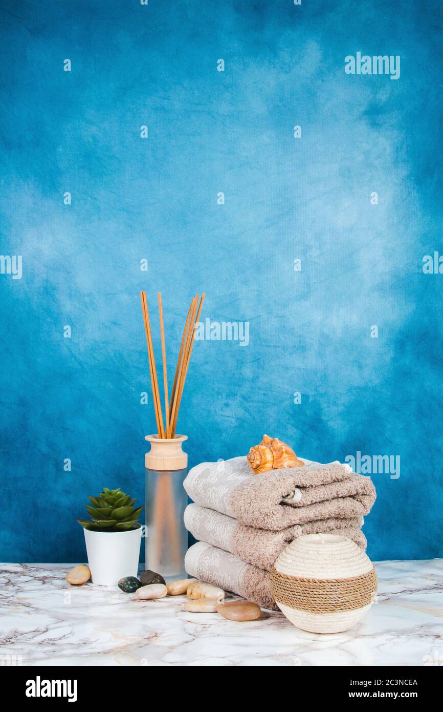 Spa objects and elements on a marble table and blue background Stock Photo