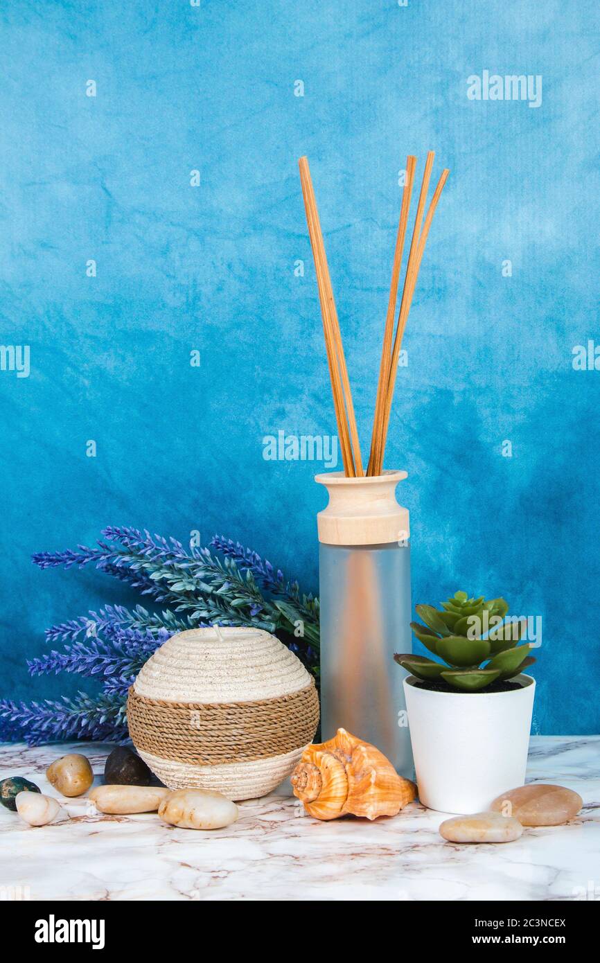 Spa objects and elements on a marble table and blue background Stock Photo