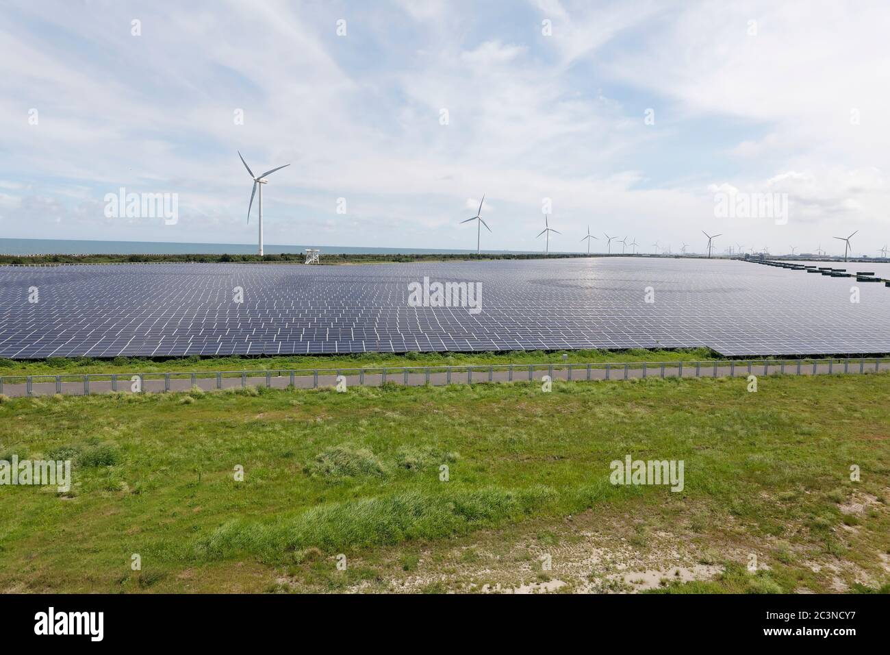 Windmill and solar power station Stock Photo - Alamy