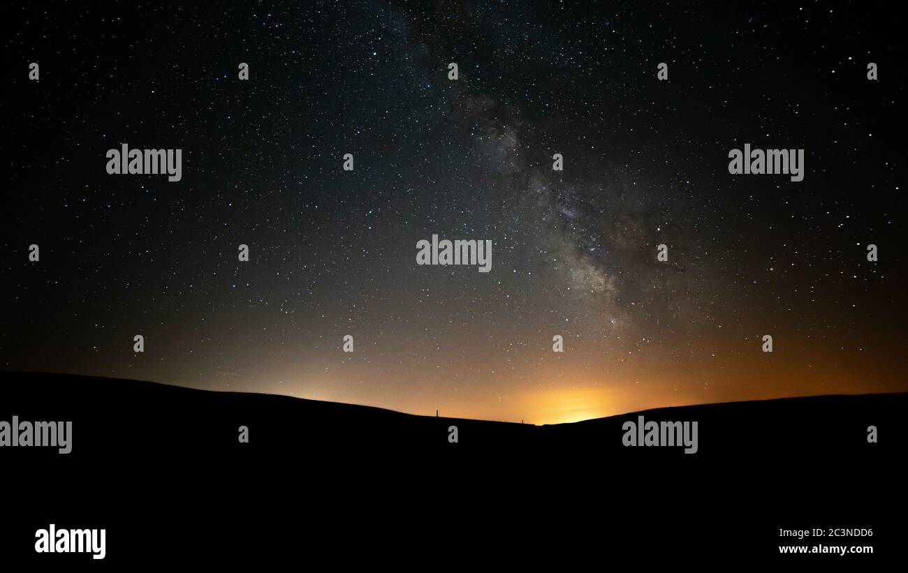 Bright stars of the Milky Way in the night sky above the horizon before the dawn Stock Photo Alamy