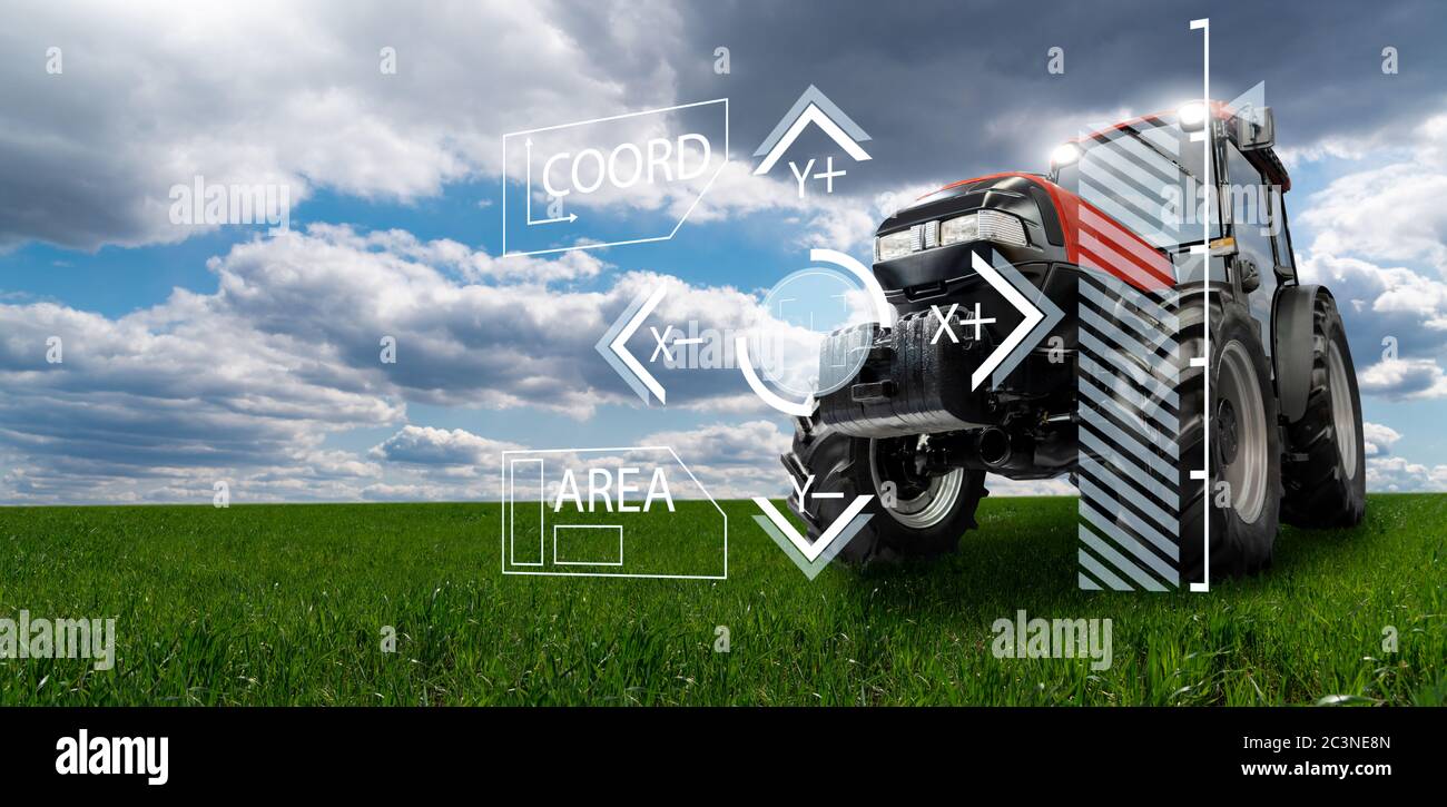 Autonomous remote controlled agricultural tractor on the field. Digital transformation in agriculture Stock Photo