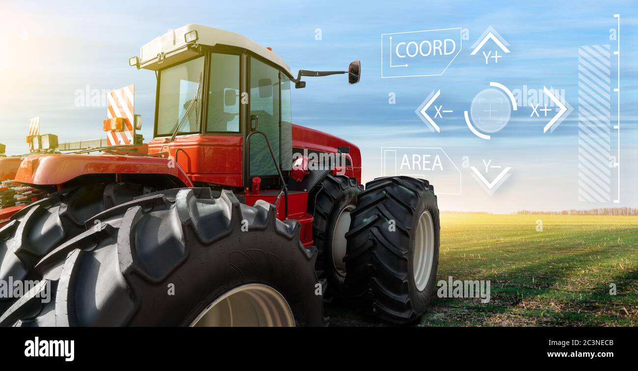 Autonomous remote controlled agricultural tractor on the field. Digital transformation in agriculture Stock Photo