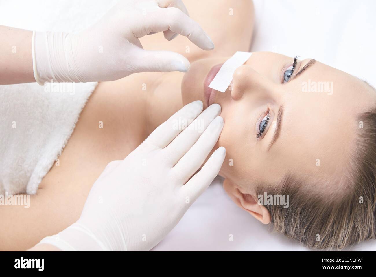 Waxing woman leg. Sugar hair removal. laser service epilation. Salon wax beautician procedure