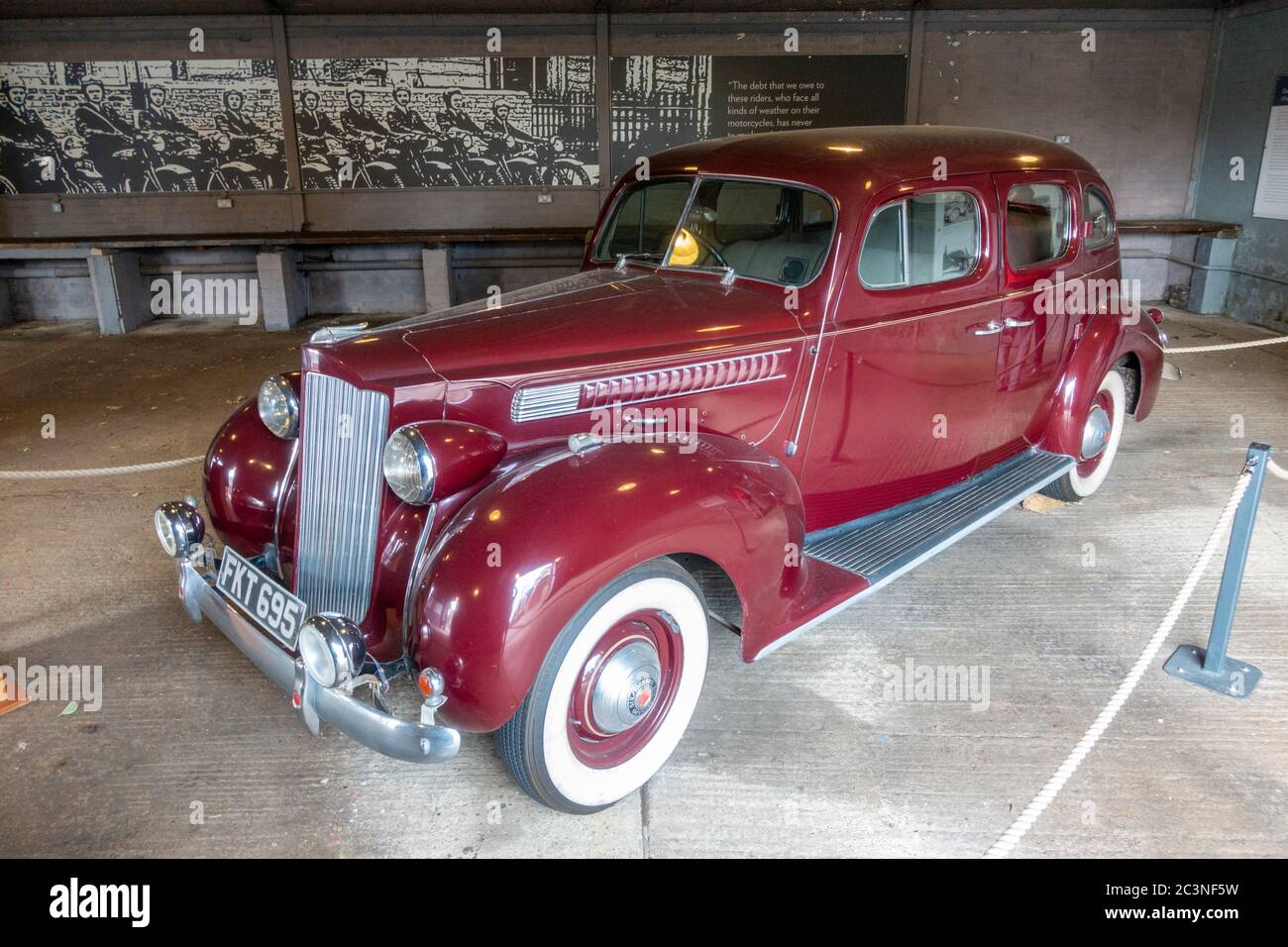 A 1940 Packard Six touring sedan on display in the vehicle garages, Bletchley Park, Bletchley, Buckinghamshire, UK. Stock Photo
