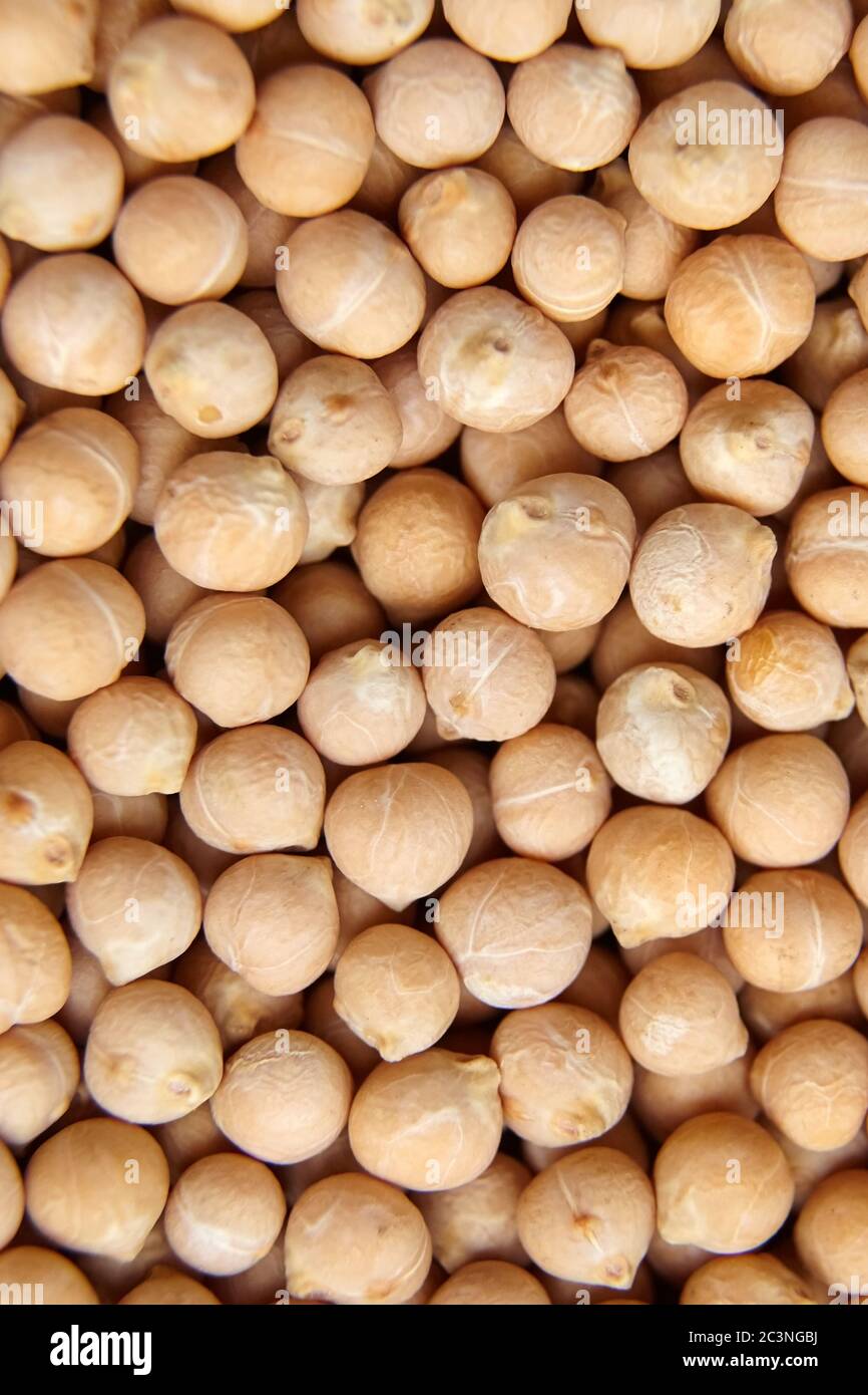 Chickpea seeds background, top view. Chick peas, or garbanzo beans, are