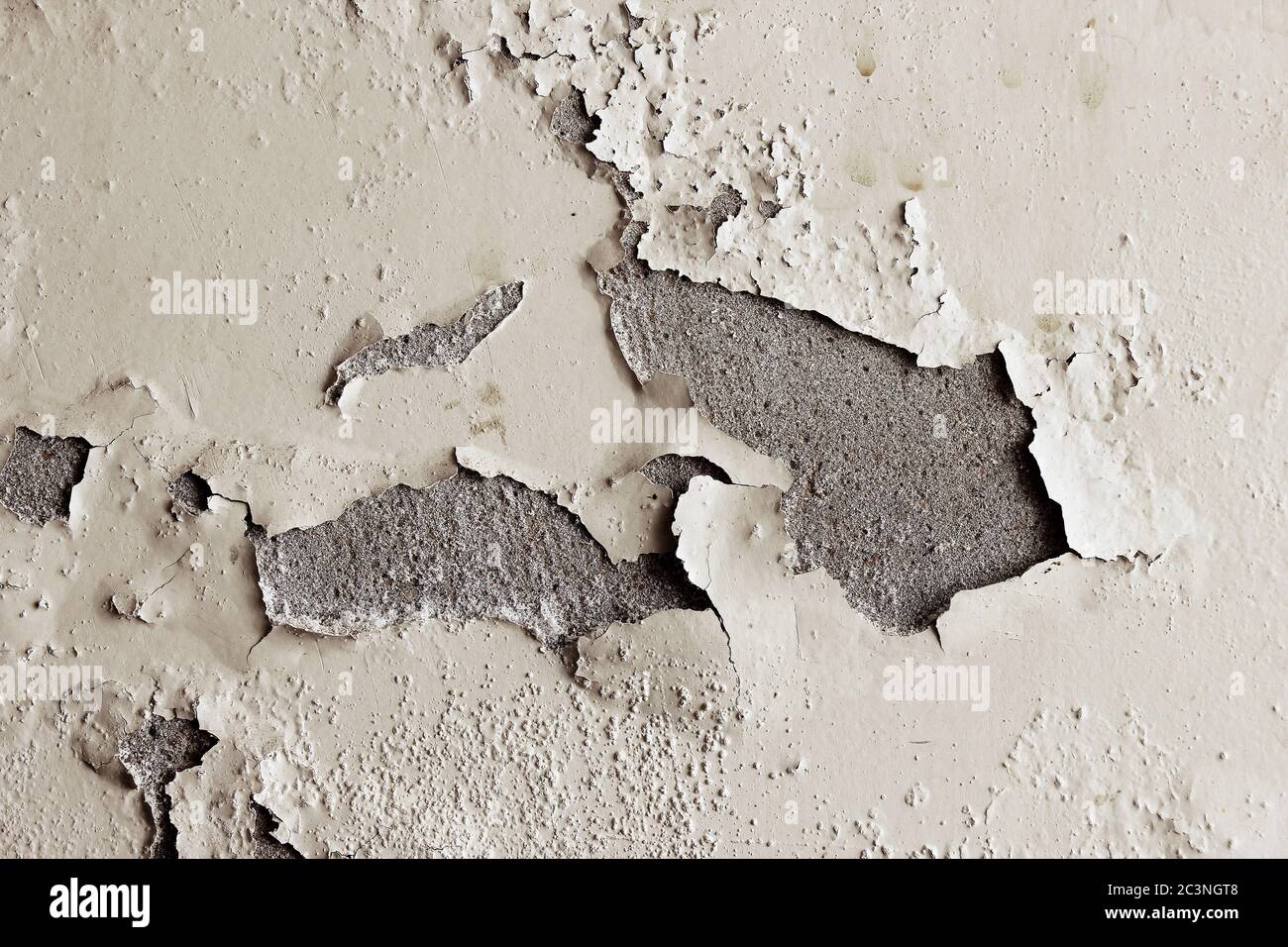 Old cracked paint on the concrete wall good for texture and background Stock Photo