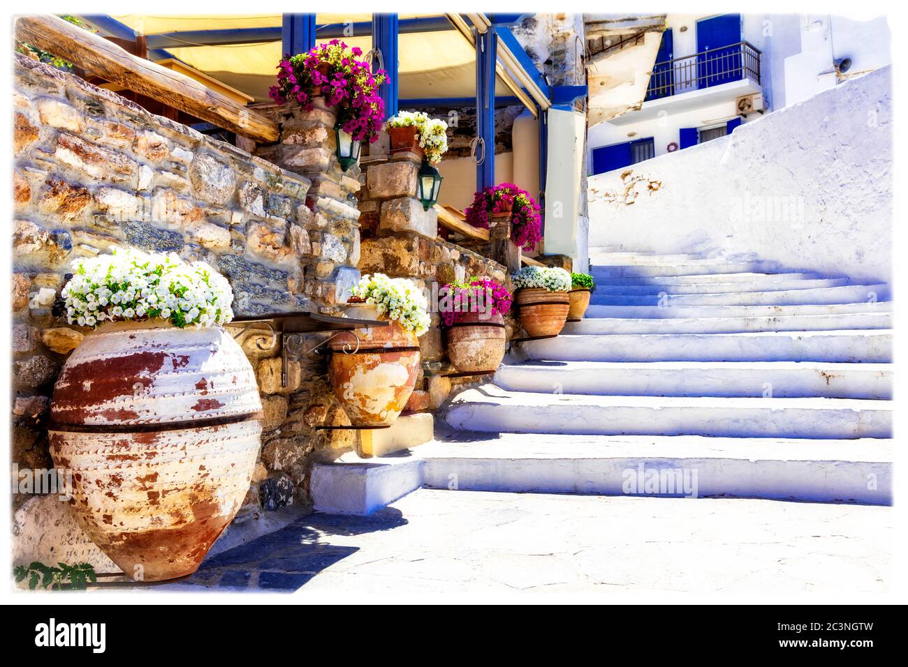 Traditional Greece. Charming floral narrow strees of  Naxos island, Cycades. Stock Photo