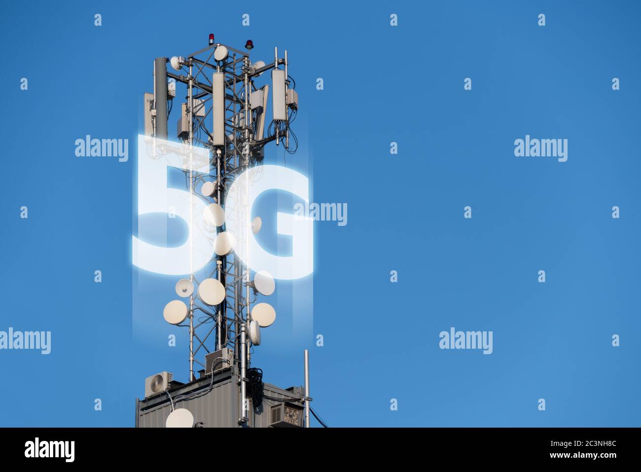 5G network transmitters on the roof of a skyscraper Stock Photo