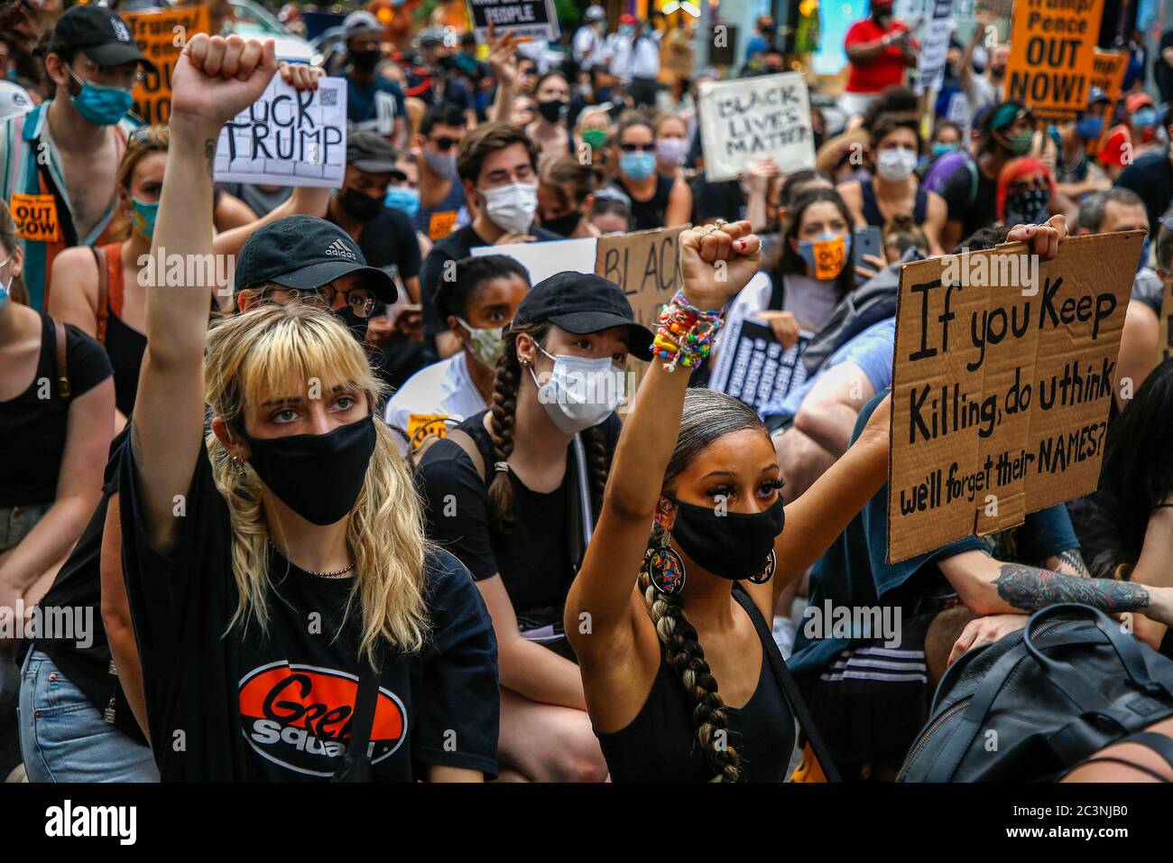 Protesters hold placards during the demonstration. Hundredths demonstrate in New York against President Trump's Fascist KKKAMPAIN and Black Lives Matter march on Juneteenth weekend. Demonstrators continue to march against police brutality and racial injustice across America. Stock Photo