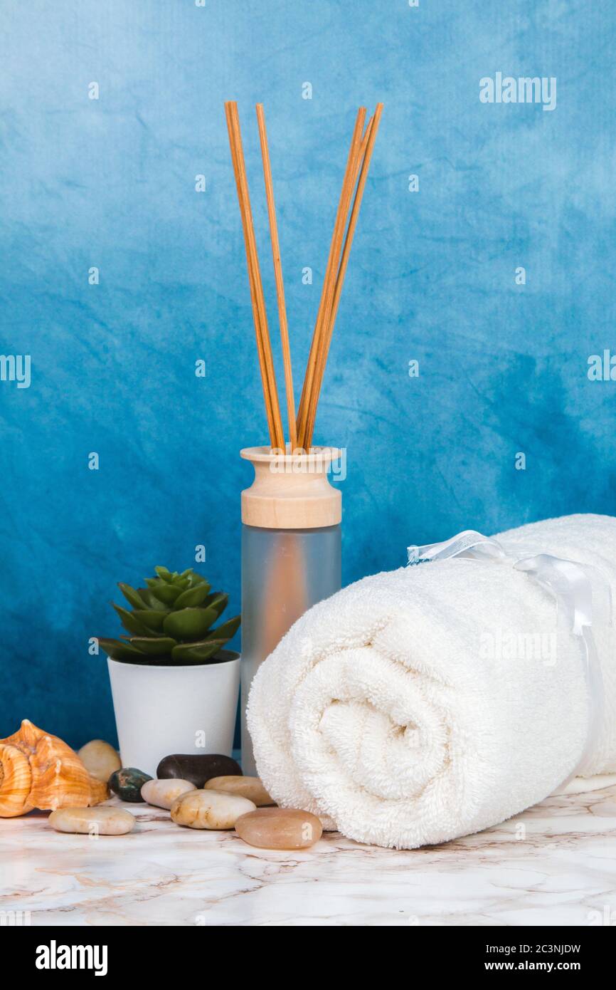 Spa objects and elements on a marble table and blue background Stock Photo