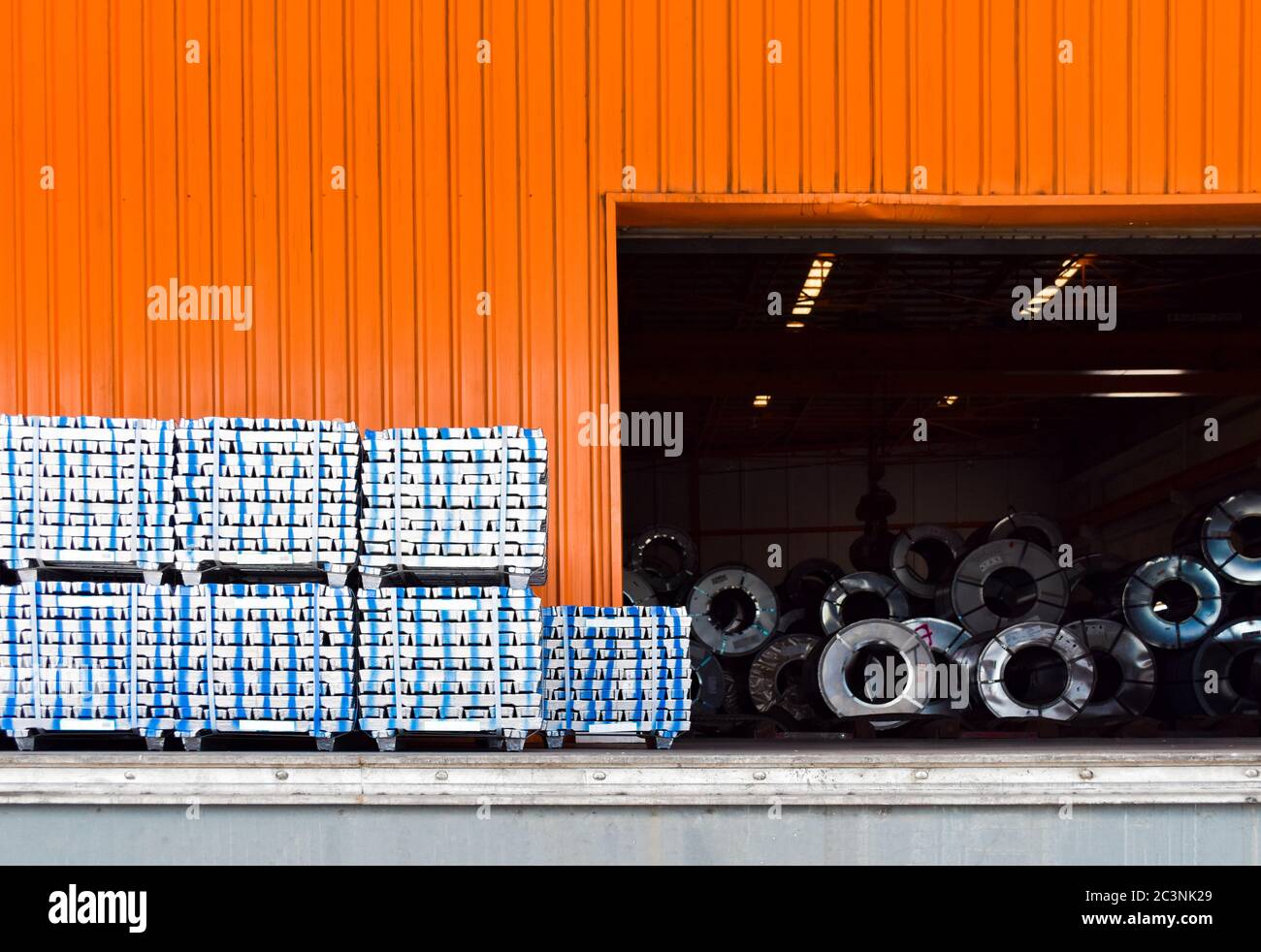 Pack of aluminum ingot bar stack on warehouse dock for container