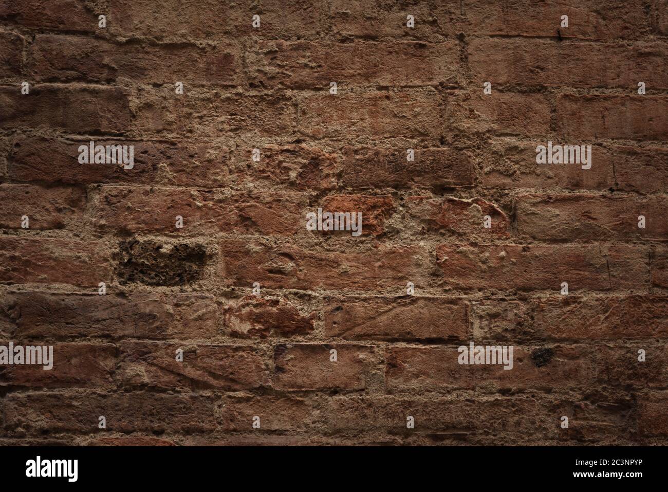 Old brick wall, old texture of red stone blocks close-up Stock Photo