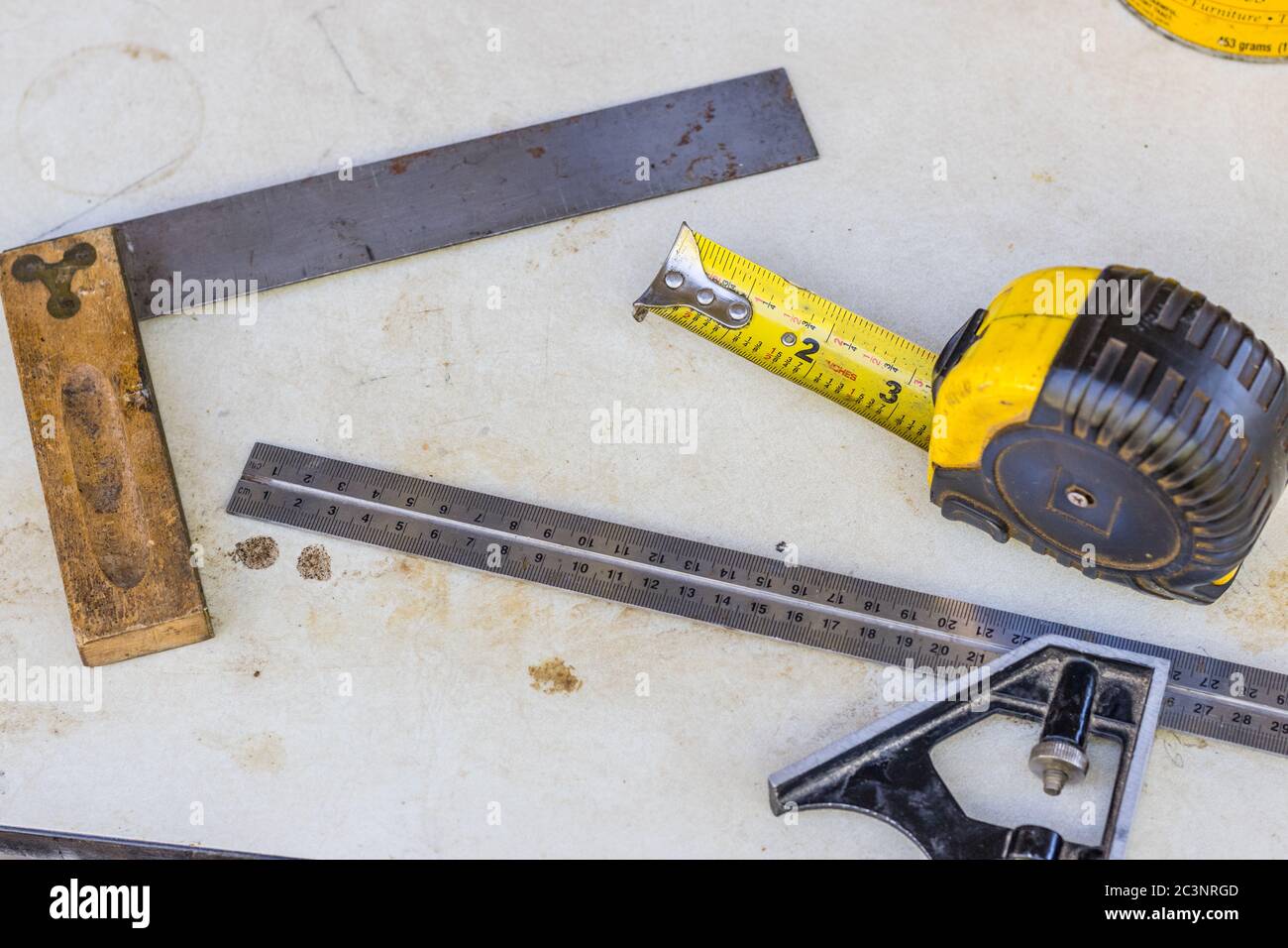 An assortment of measuring tools, try square,machinists square,tape measure Stock Photo