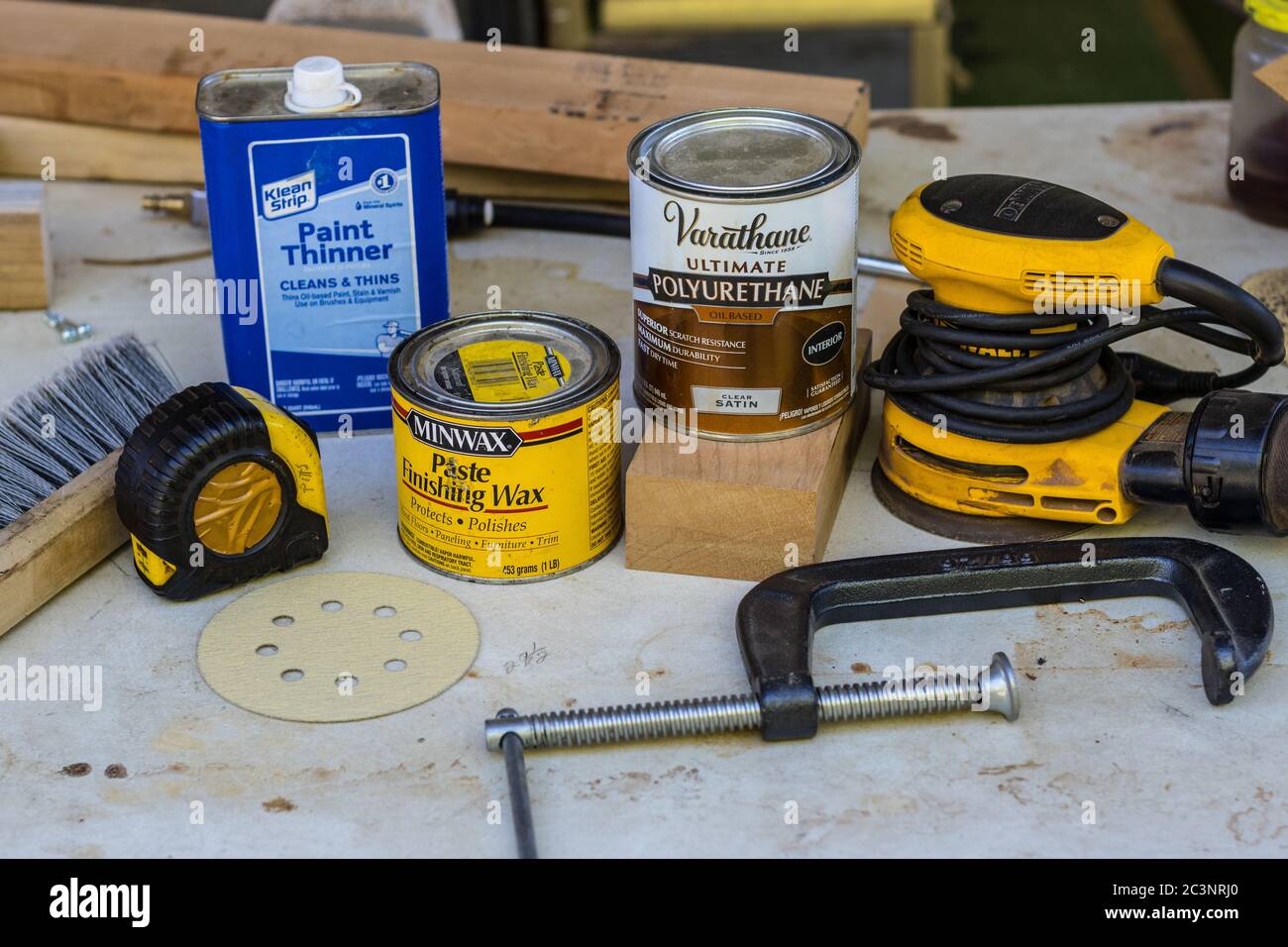An assortment of woodworking products, sandpaper,wax,polyeurethane
