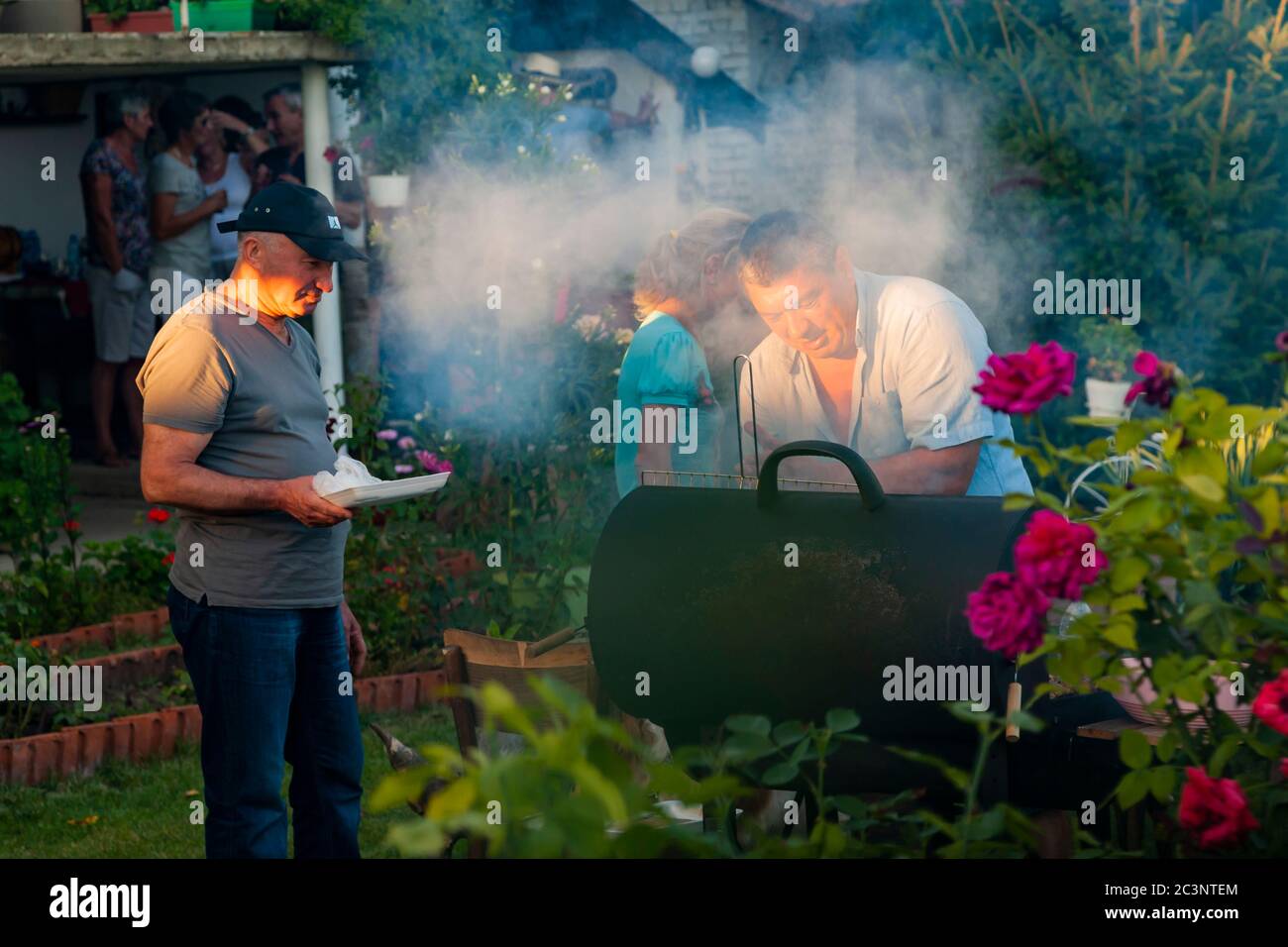 At charcoal grill in a Bulgarian dacha garden Stock Photo