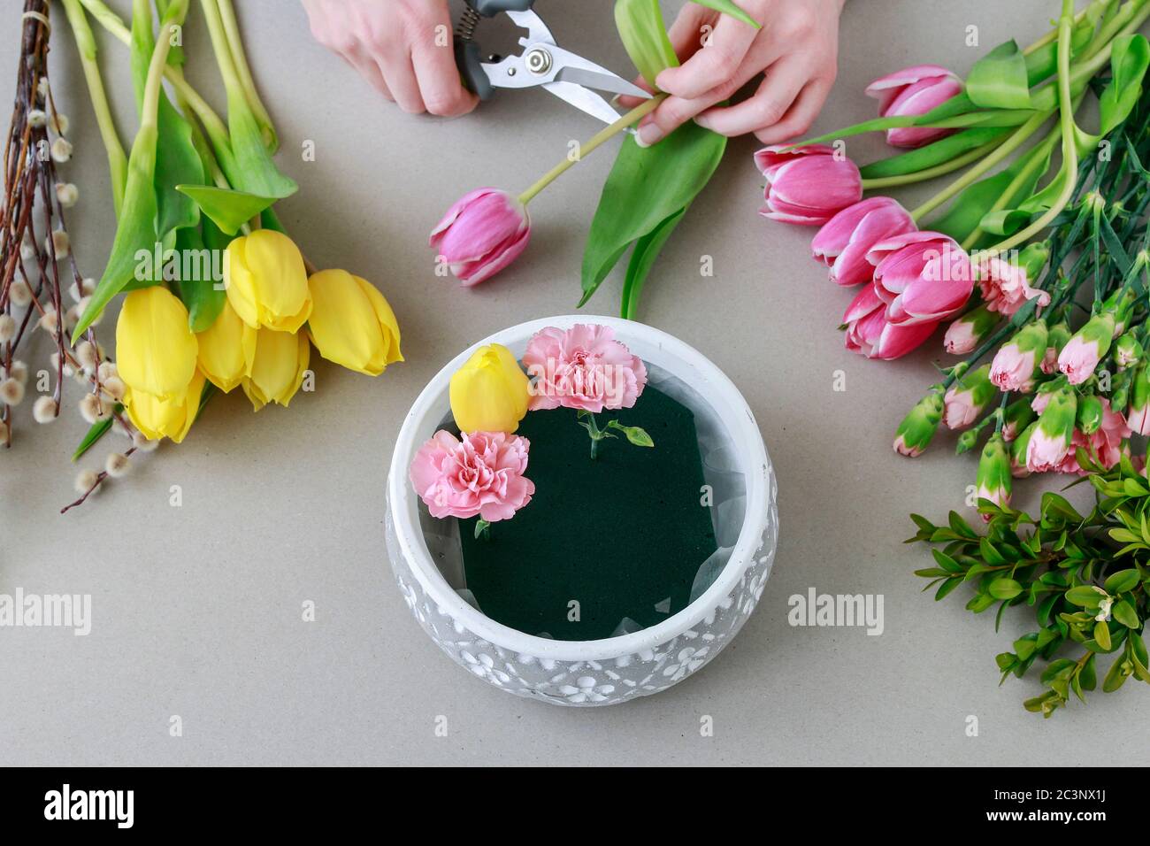 Flower arrangement using flower arranging foam Stock Photo - Alamy