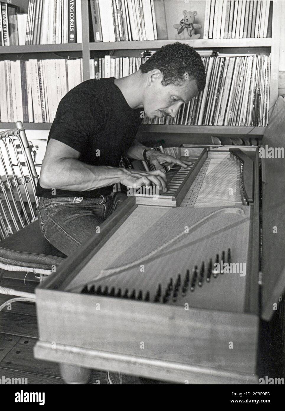 1983 posed portrait of jazz pianist composer Keith Jarrett playing the harpsichord in his Pennsylvania home Stock Photo
