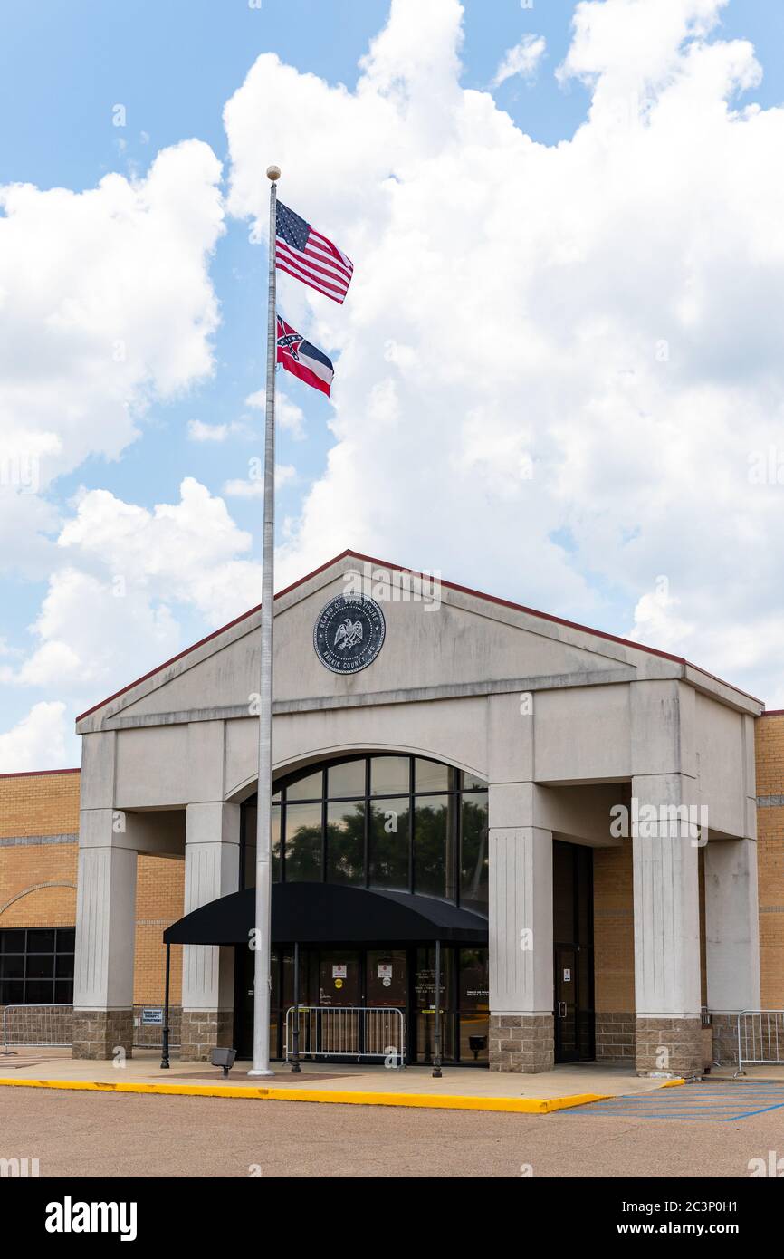 Brandon, MS / USA - June 20, 2020: Rankin County Courthouse Annex building with the seal of the board of Supervisor and a Mississippi flag and USA Fla Stock Photo