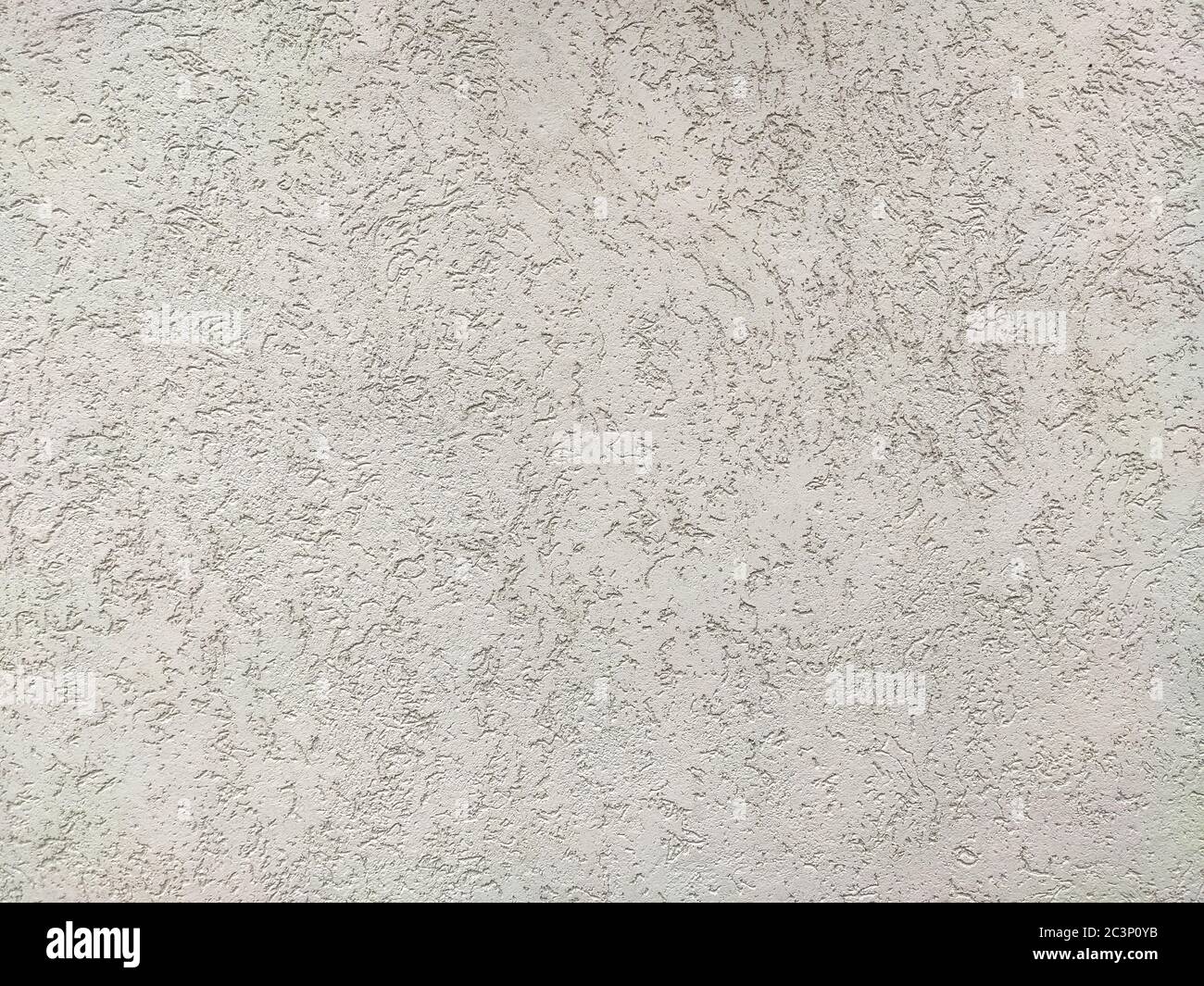 The texture of the plaster is bark beetle on the wall. Seamless white texture. Stock Photo
