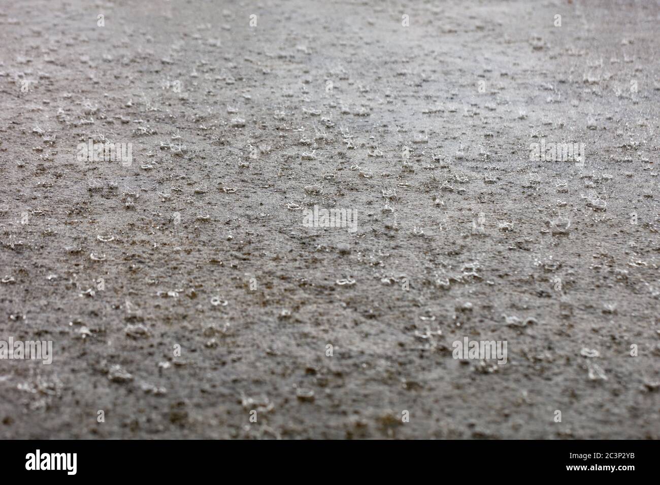 Rain drops falling on pavement hi-res stock photography and images - Alamy