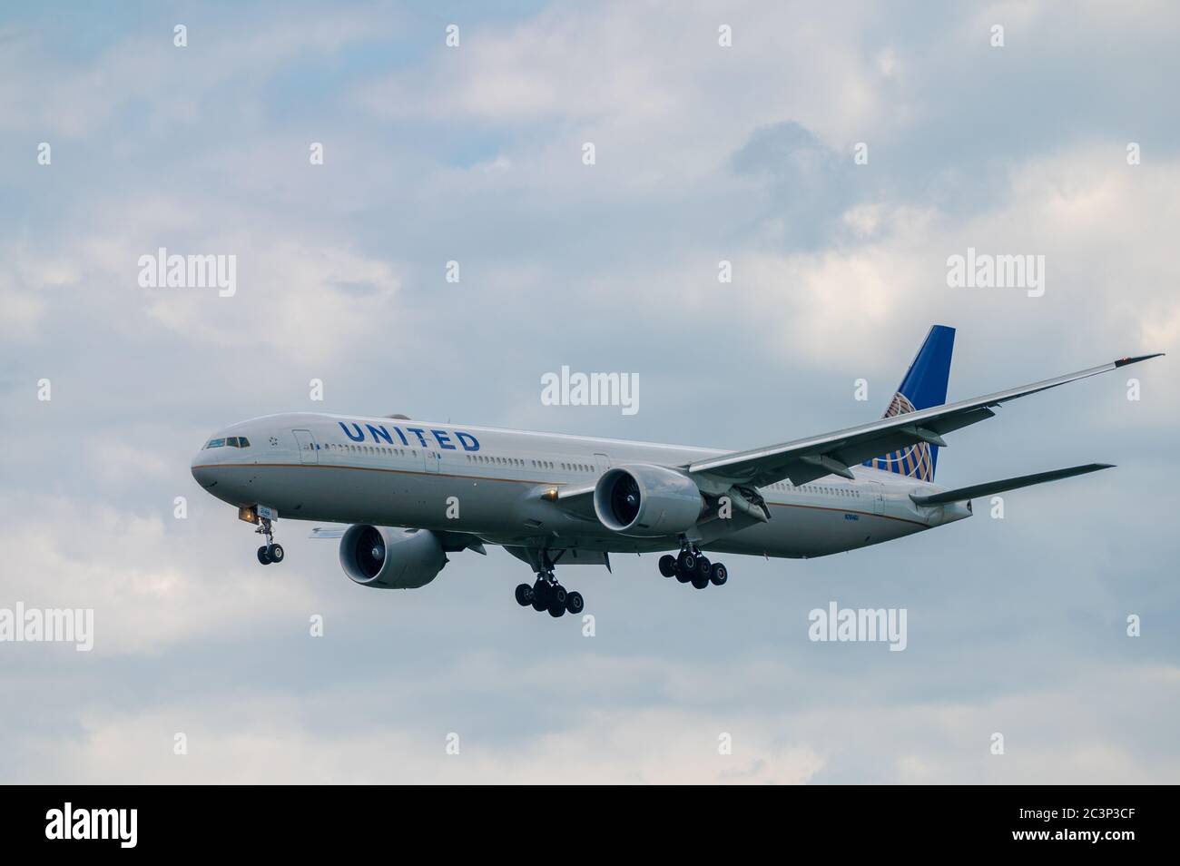 United Airlines Boeing 777-300ER N2846U wide body airplane approaching to land at Frankfurt Airport in Germany Stock Photo
