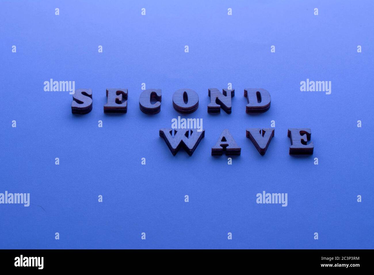 Second wave COVID19 text on blue background. 2nd Wave of Coronavirus is coming Stock Photo