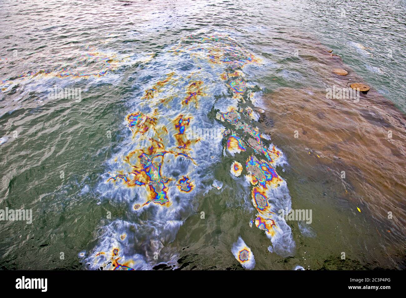 Oil spill polluting the ocean Stock Photo