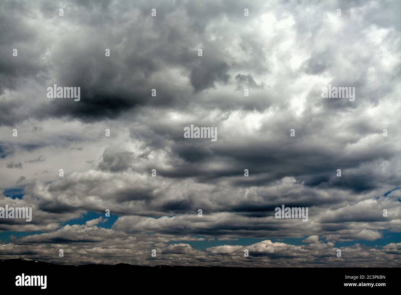 Low angle shot of the beautiful and fluffy rain clouds in the sky Stock ...
