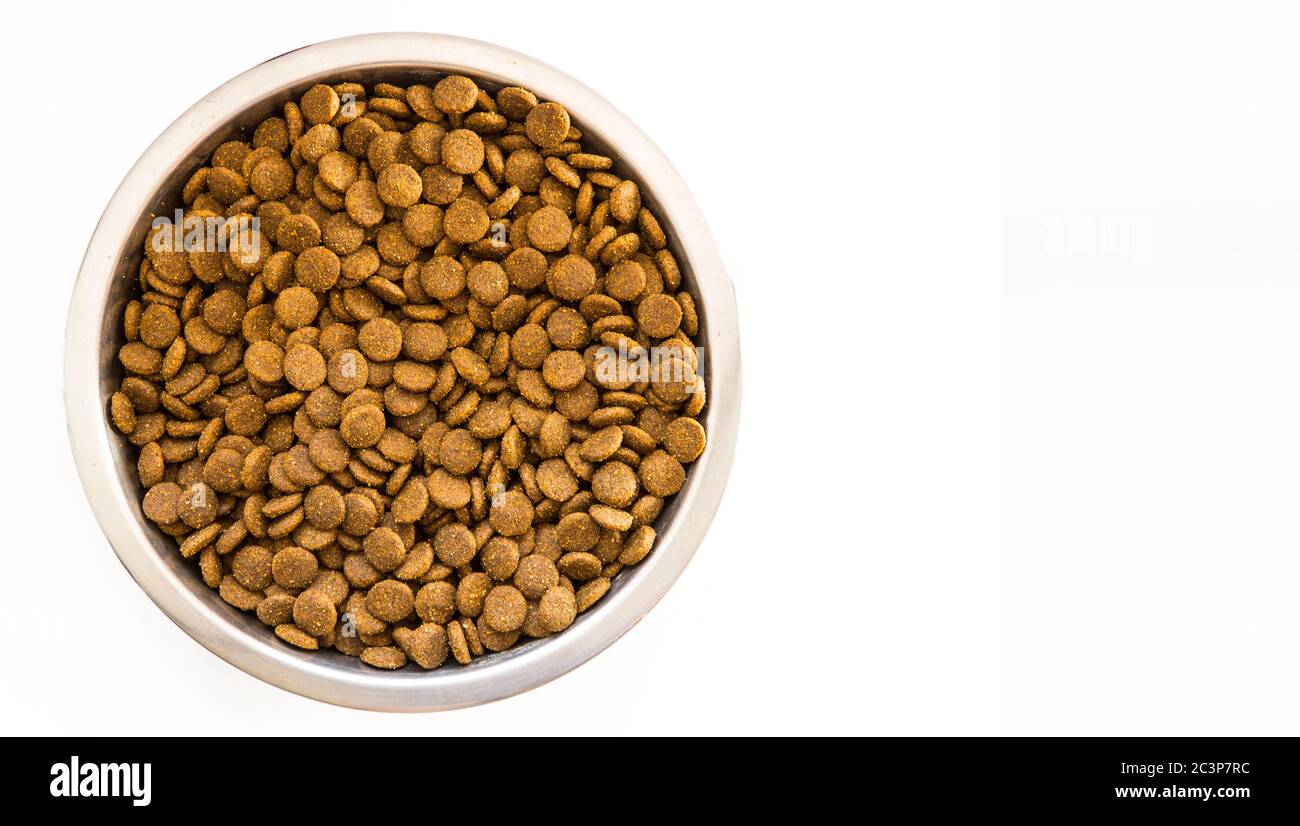 Dry Dog and Cat food. Pile of kibbles in a metal food bowl. Top view on ...