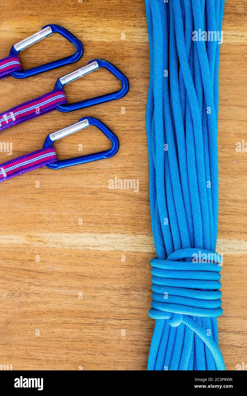 Overhead shot of blue climbing rope and quickdraws under the light