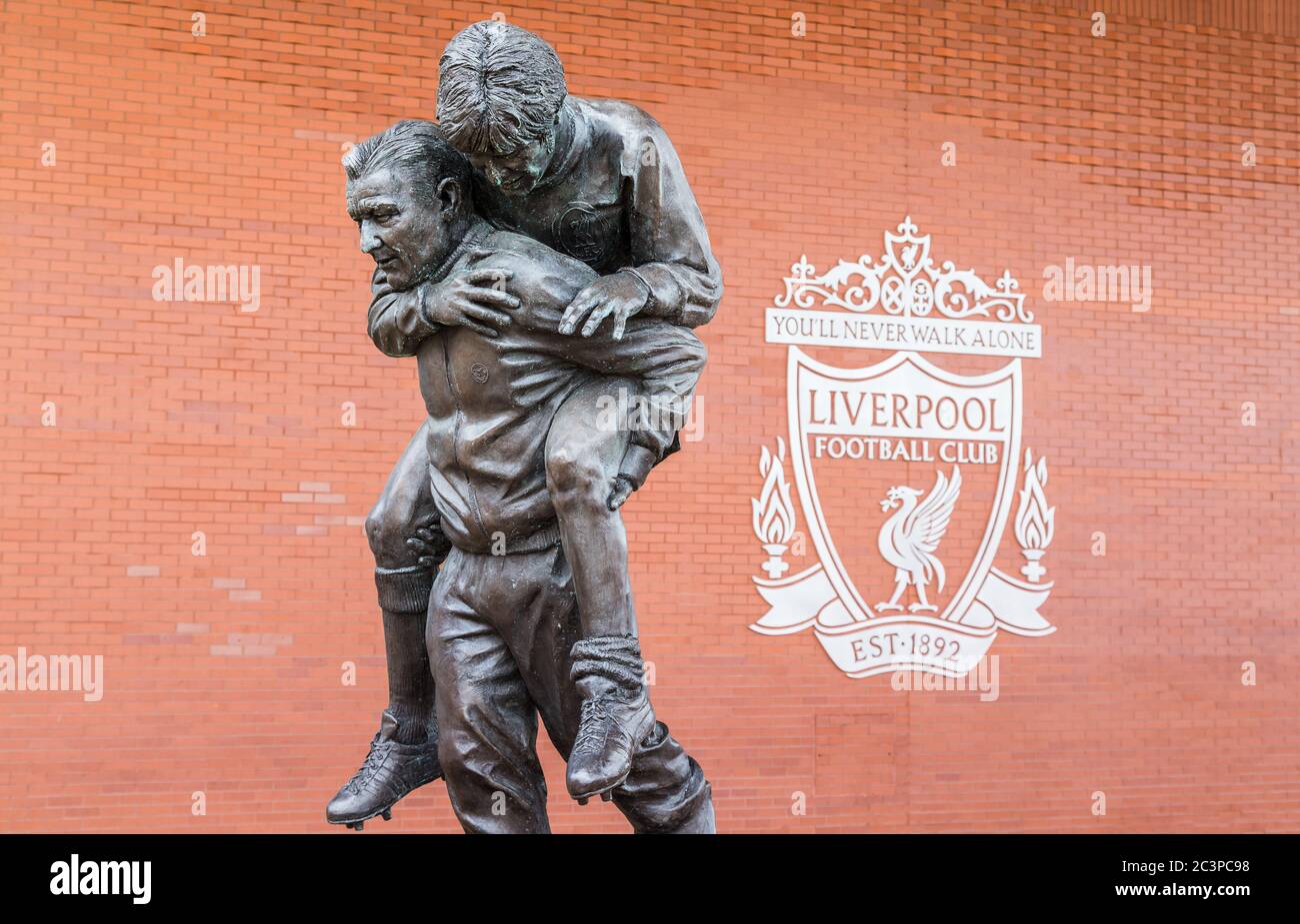 Statue of Bob Paisley carrying Emlyn Hughes seen at Anfield stadium in Liverpool (England) in June 2020.  Paisley is one of the most successful Englis Stock Photo