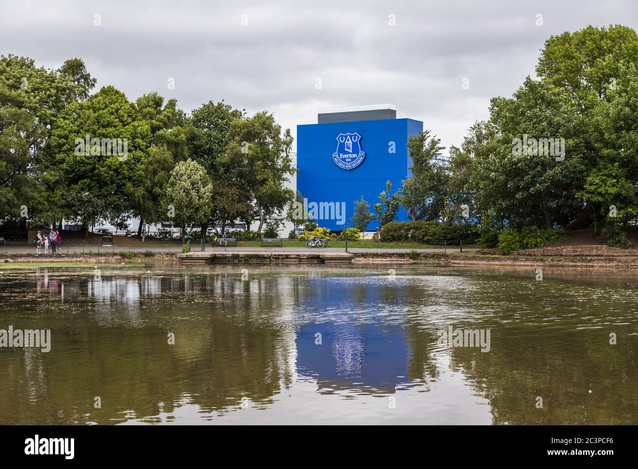 The home of Everton FC (Goodison Park) pictured reflecting in a lake within Stanley Park (England) in June 2020. Stock Photo