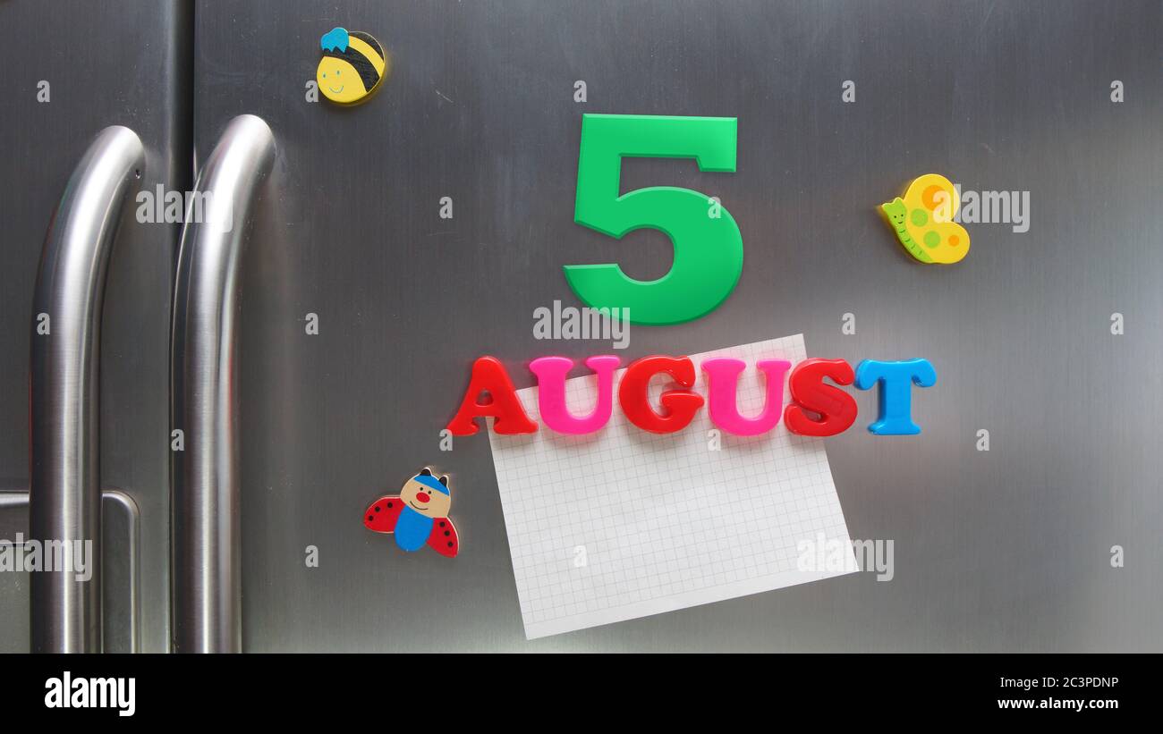 August 5 calendar date made with plastic magnetic letters holding a note of graph paper on door refrigerator Stock Photo