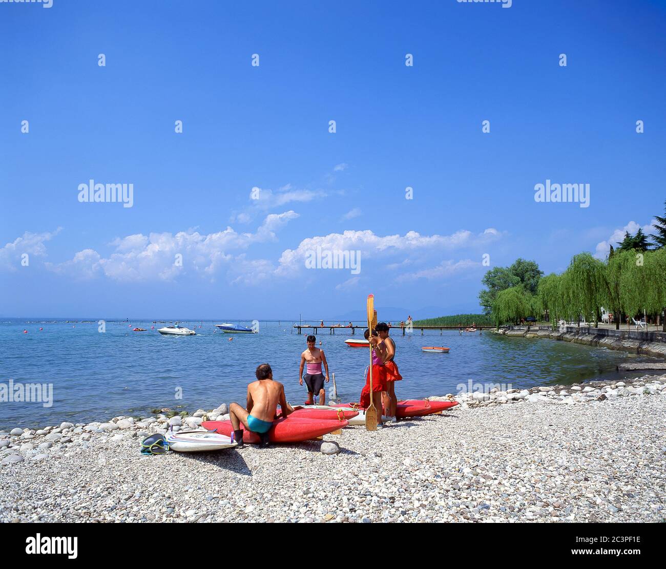Family group kayaking on Lake Garda, Peschiera del Garda,  Verona Province, Veneto Region, Italy Stock Photo